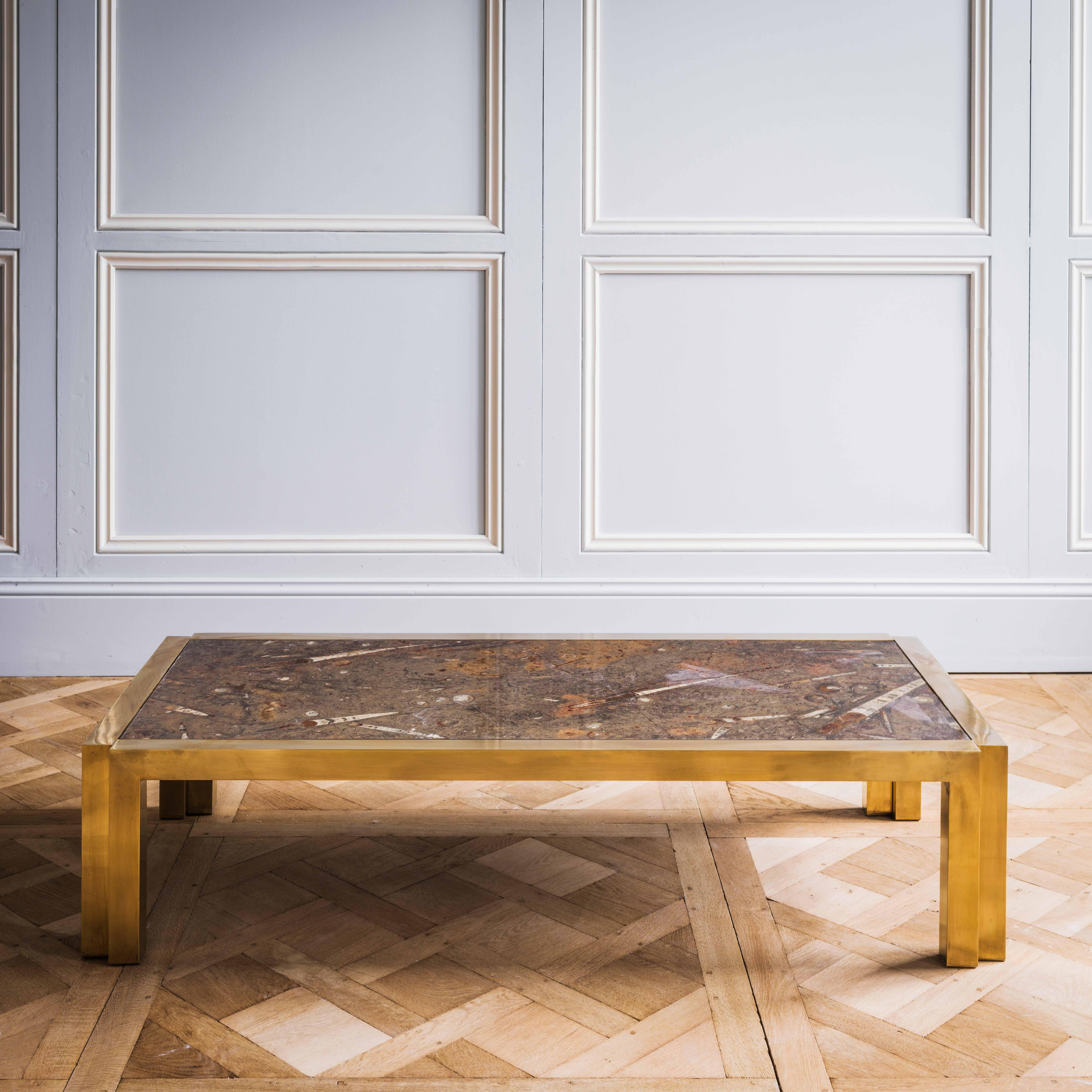 A beautiful mid-20th century Italian brass coffee table with fossil marble top.