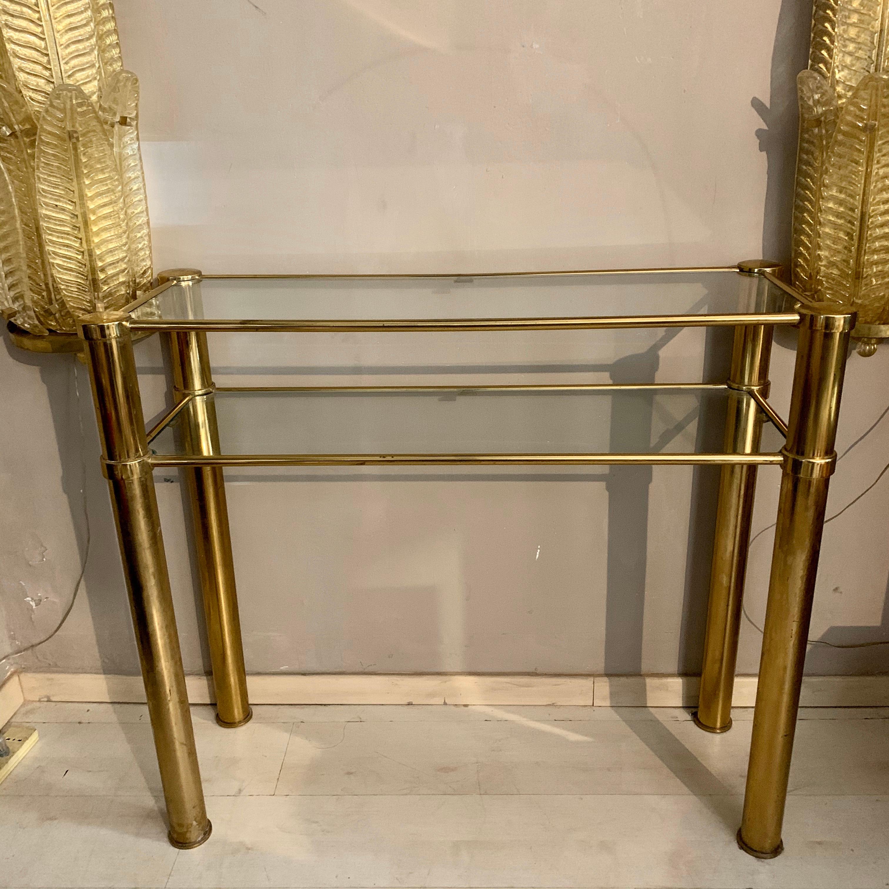 Italian brass console with double crystal shelves. The brass has its original patina.
Good vintage condition.