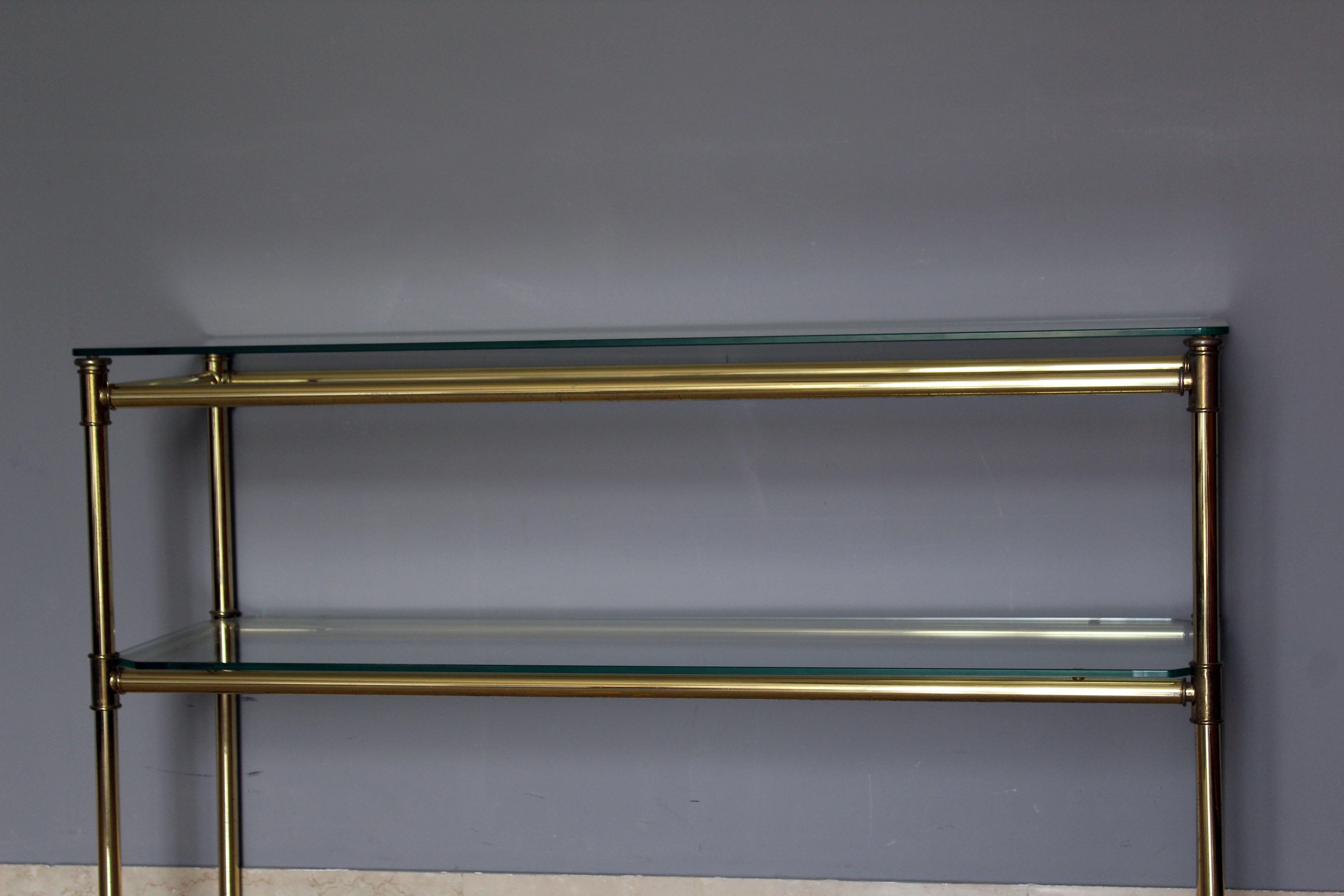 Brass and glass console with matching mirror.
Made in Italy, circa 1970.