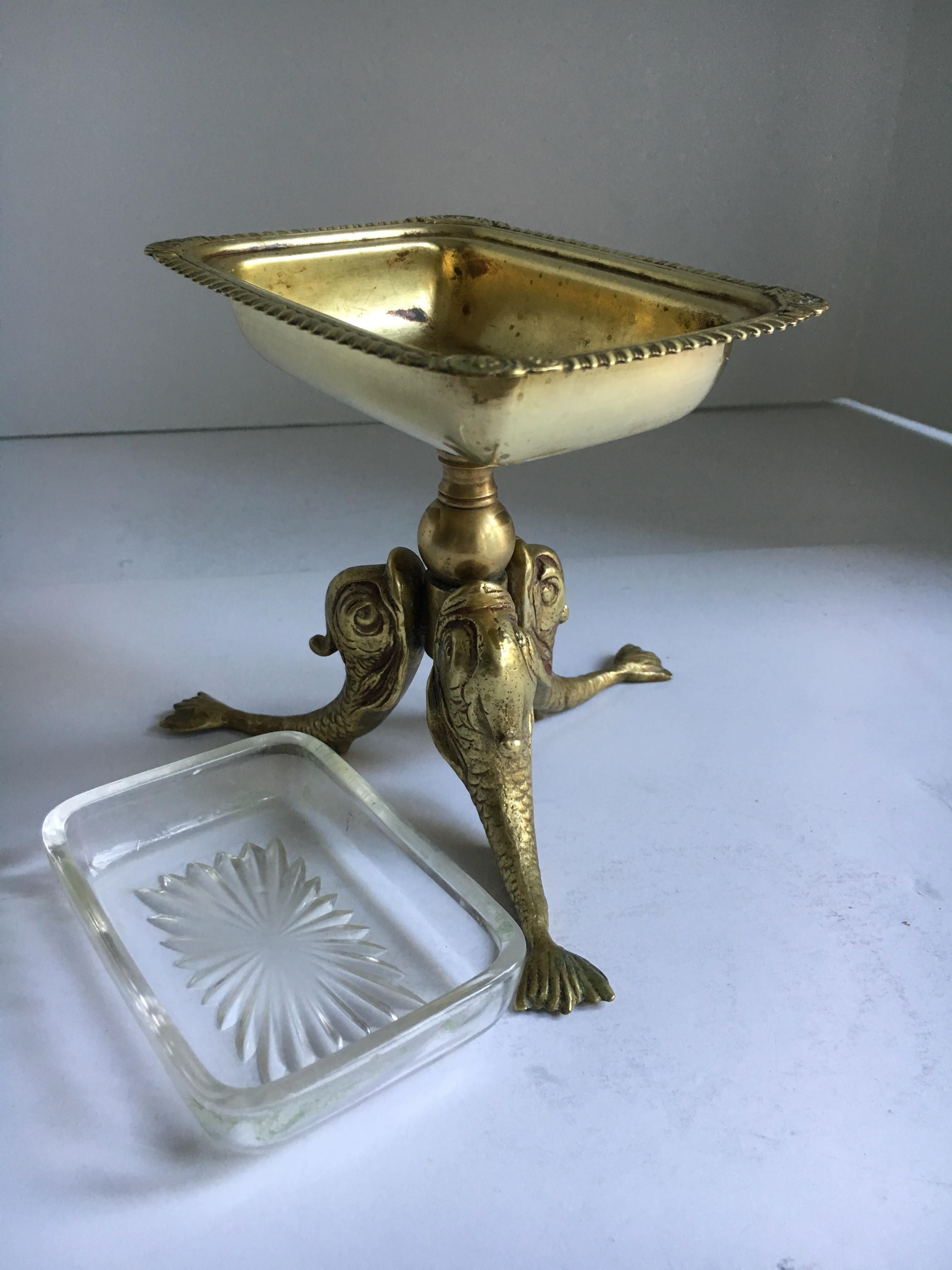Exquisite and beautiful, three brass dolphin's supporting a soap dish - or is it Use this piece for business cards, or anything from candy - rubber bands - heavy and substantial - well made and a true beauty.