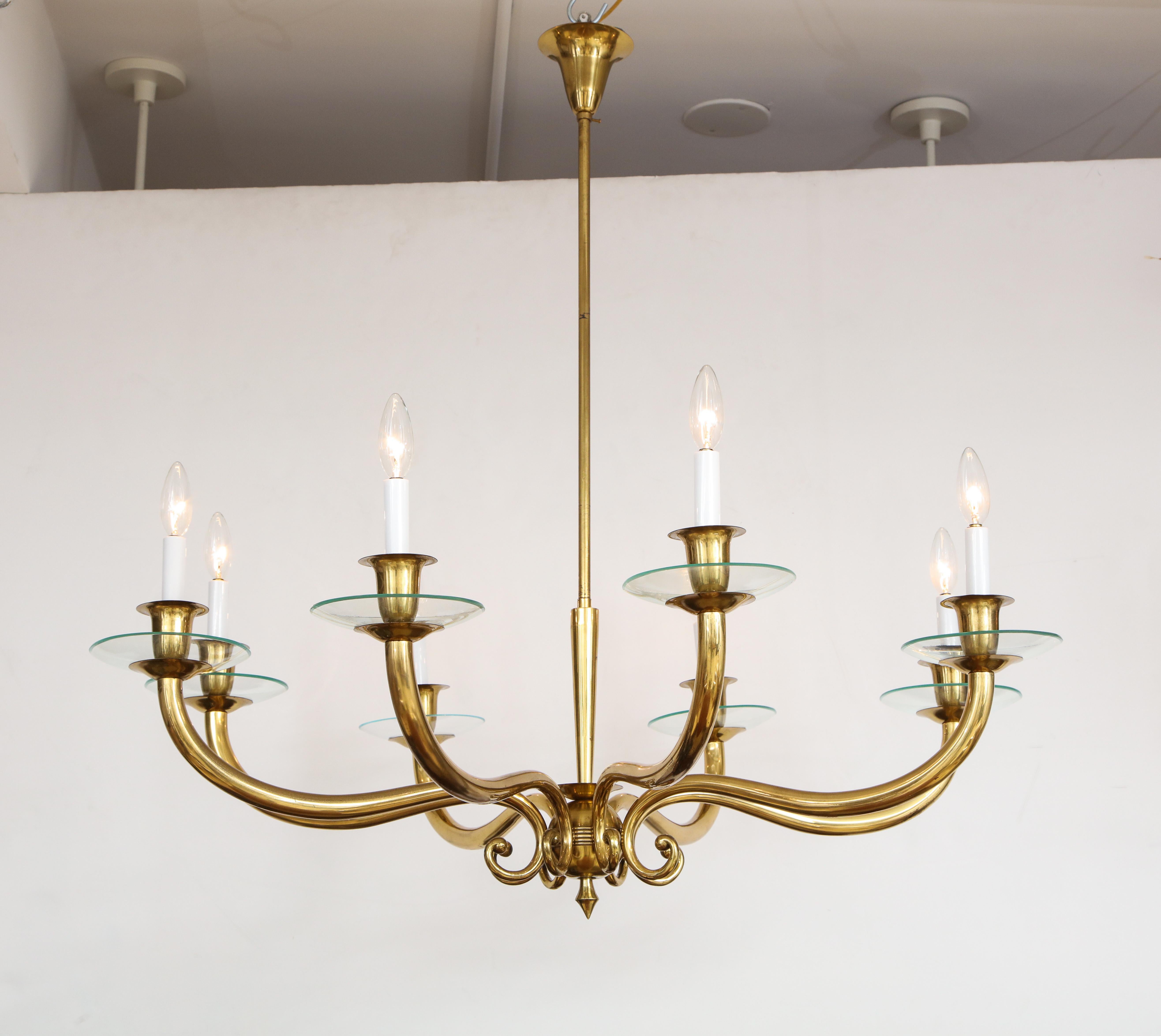 Italian midcentury brass eight-light chandelier with elegantly sloped arms surrounded by a central tapered shaft with ball shaped base.
Italy, circa 1950-60.
Size: 38” high x 40” diameter.