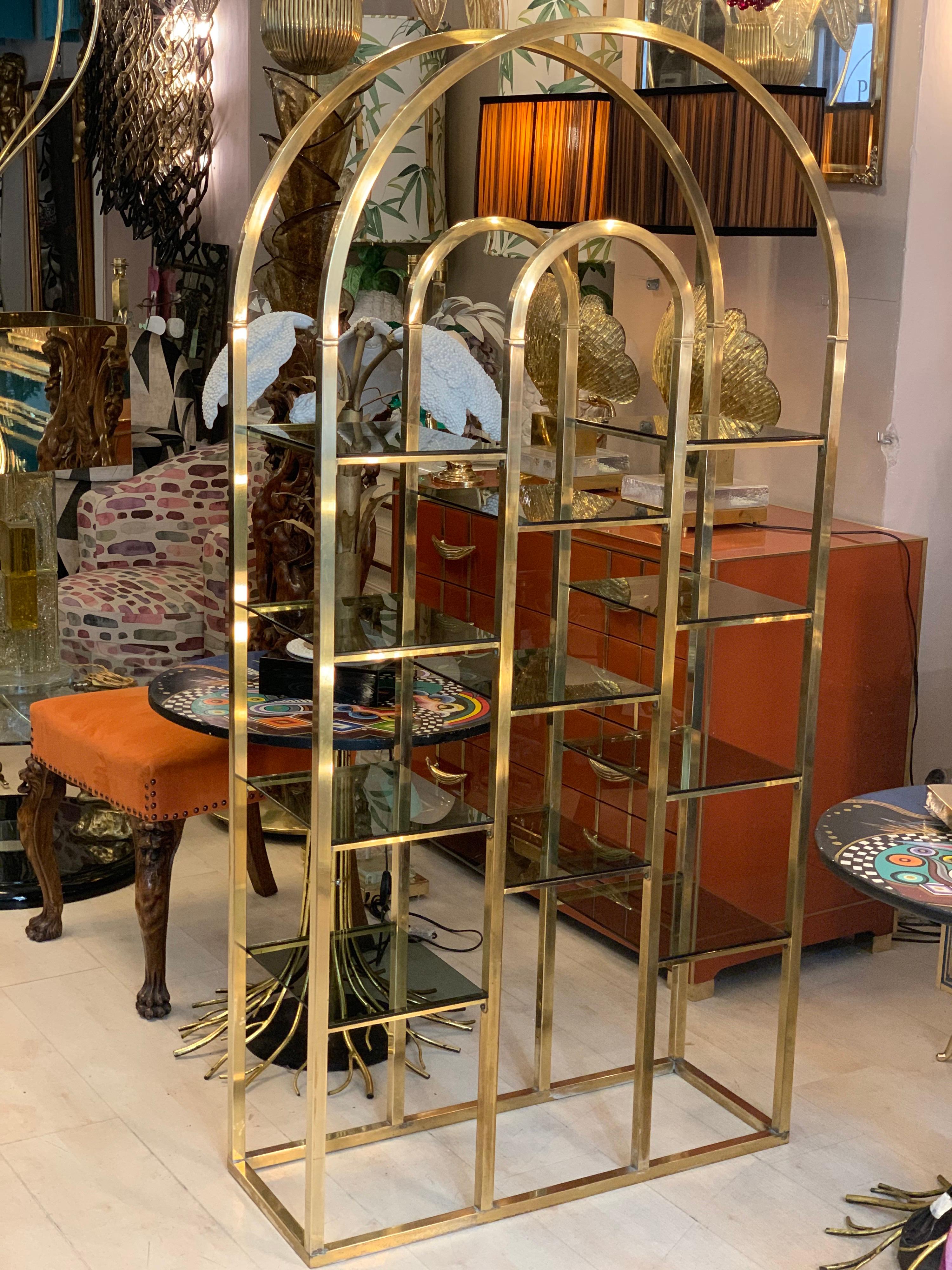 Italian brass etagère with 11 smoked glass shelves.
Perfect vintage condition.