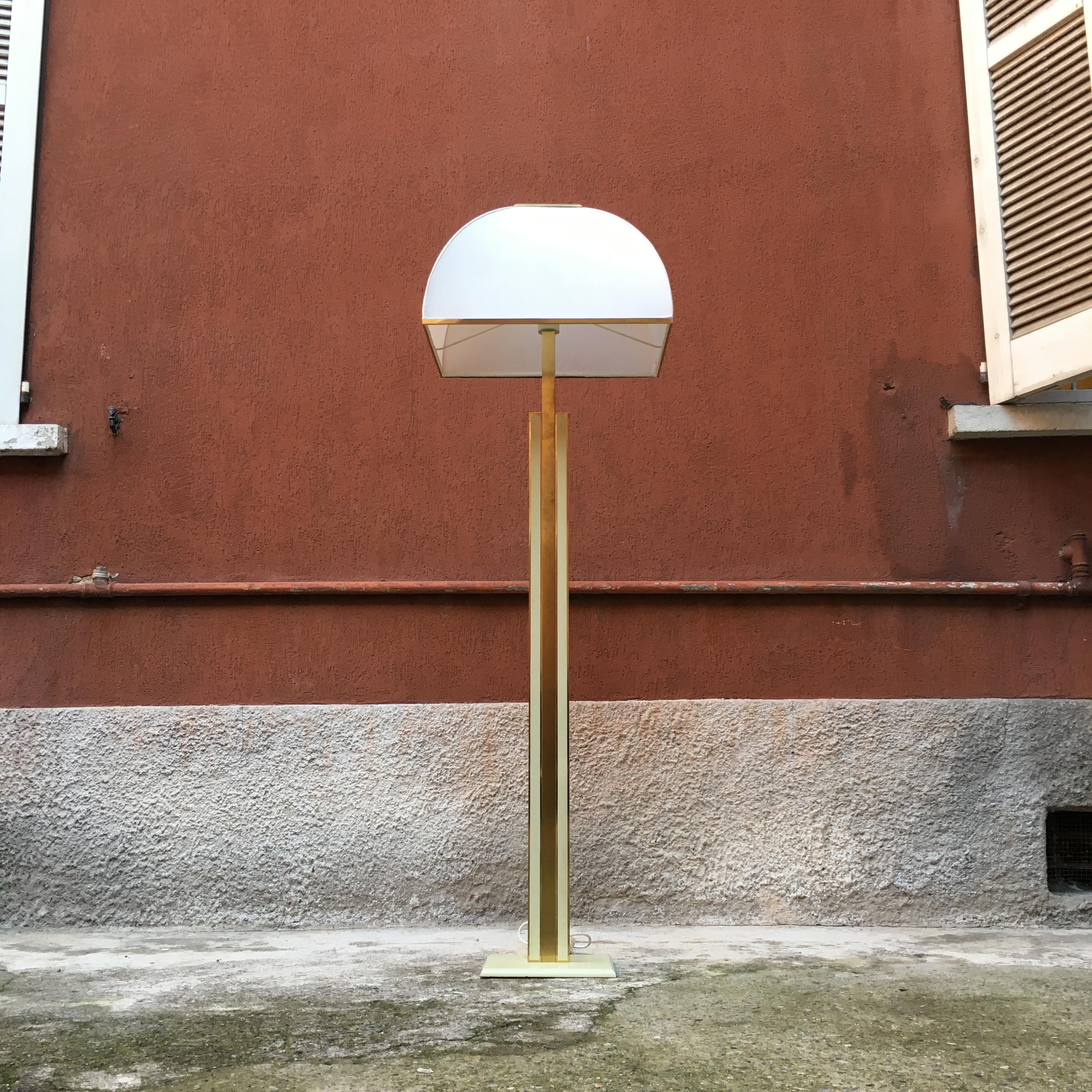 Italian brass, fabric and marble floor lamp, 1980s. Floor lamp with brass and metal structure, fabric lampshade and marble base.