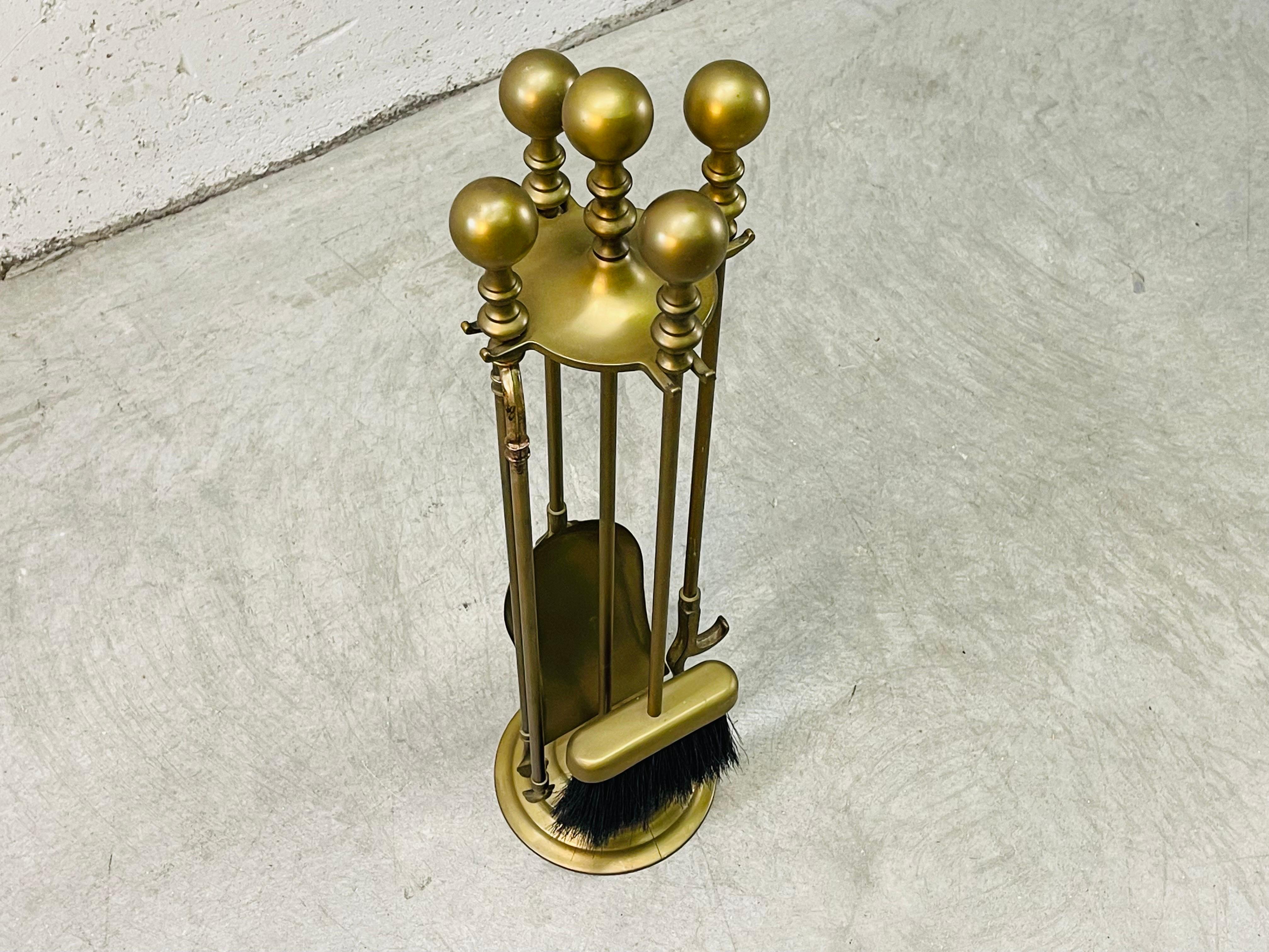 Vintage Italian brass fireplace tool set with round ball handles. The set has four tools and the stand. Marked Italy underneath.