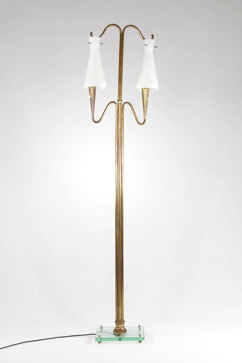 Floor lamp from Italy, 1950s. The lamp is made of brass and has two opaline glass shades on a crystal glass base.

 