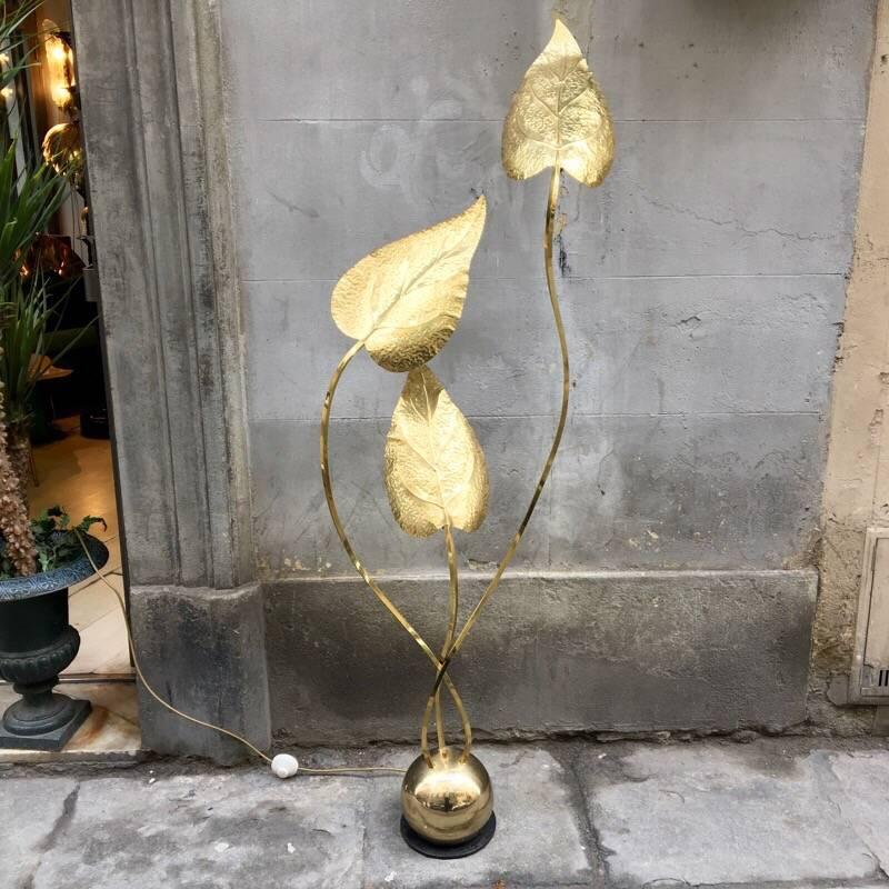 Italian brass floor lamp by Tommaso Barbi three hammered brass leaves, three bulbs. The lamp gives a great atmosphere to the room.