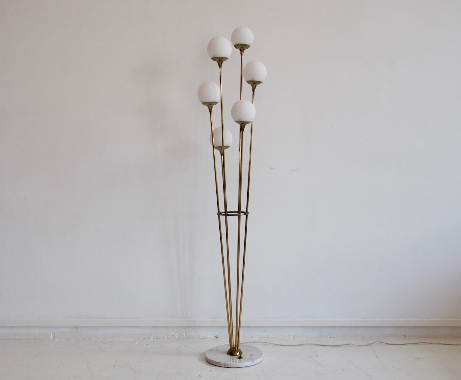 Mid-20th century Italian brass floor lamp in the style of Stilnovo with six sateen white glass shades and marble stand. The lights can be switched on as two, four or six at a time. Please note that the switch is not on the marble base of the lamp as