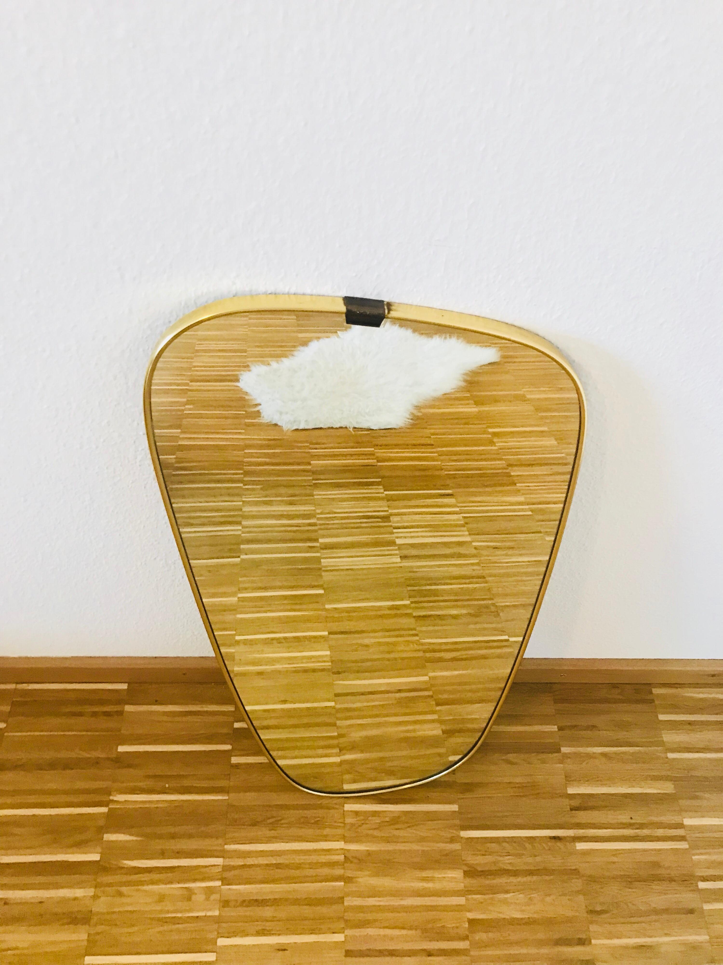 asymmetrical brass mirror