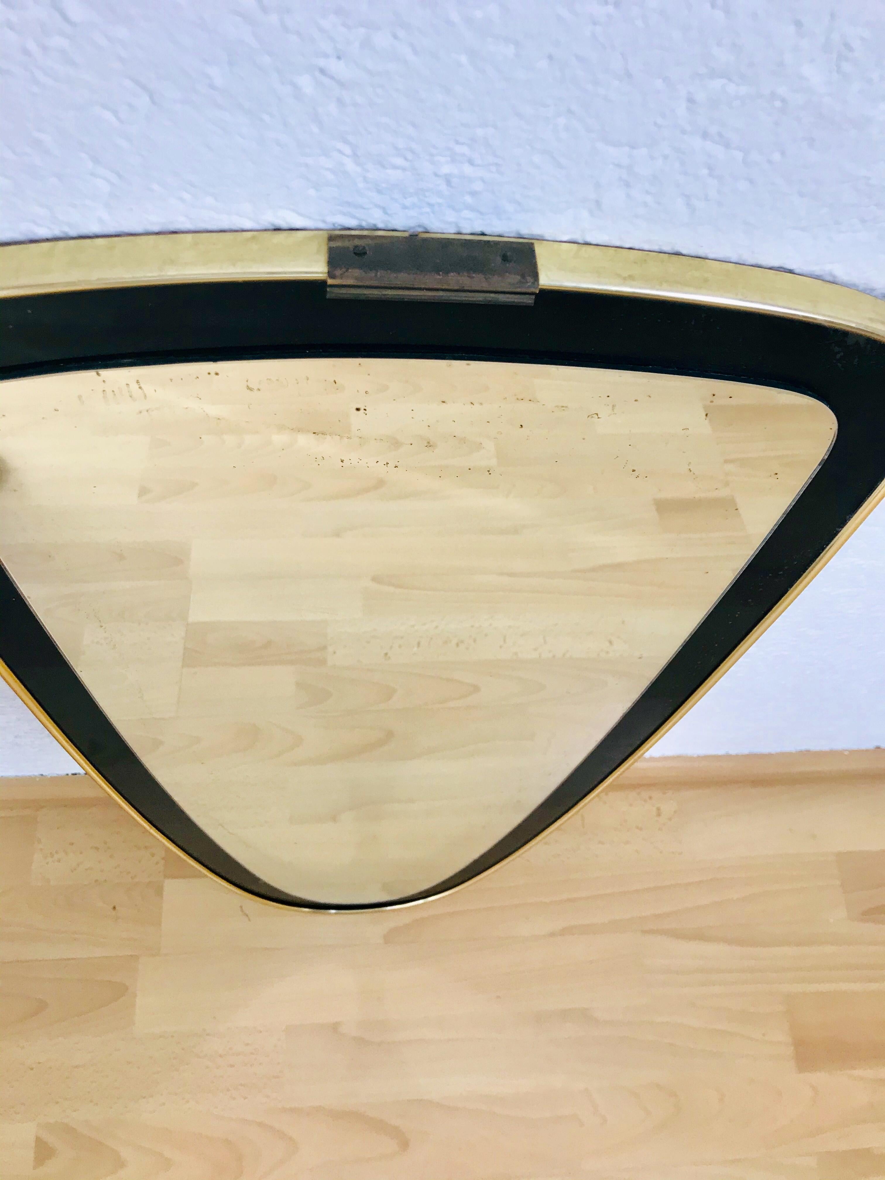 asymmetrical brass mirror