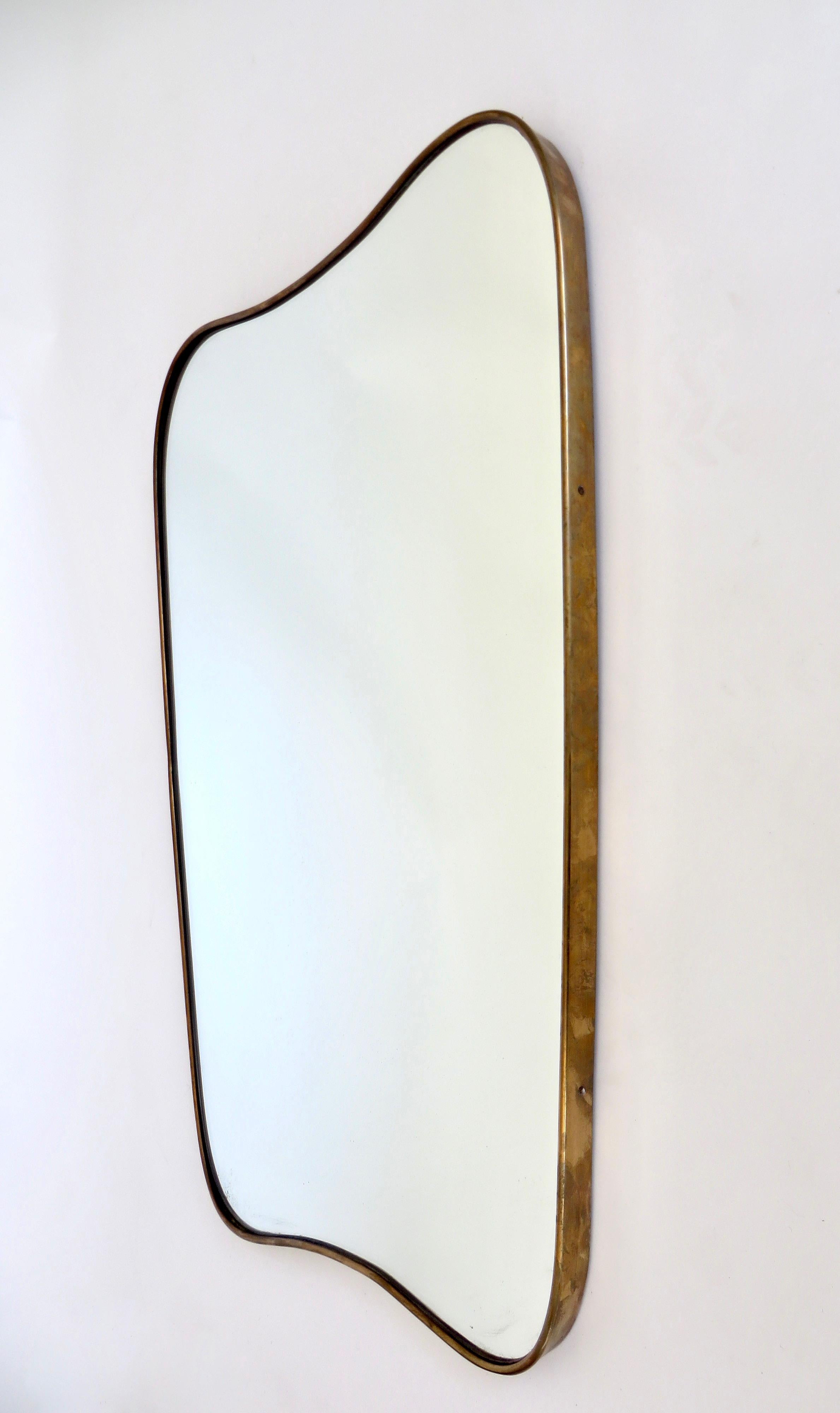 curved brass mirror