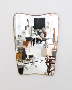 Italian Brass Framed Curved Top and Bottom Vintage Shield Shaped Mirror