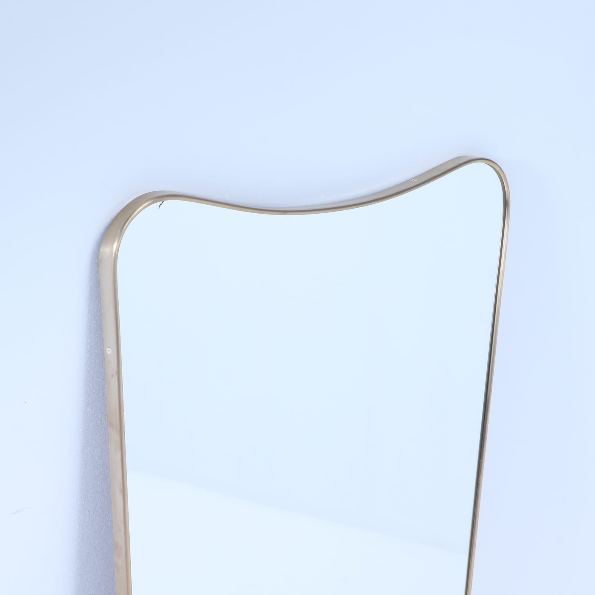Italian brass framed mirror in the manner of Gio Ponti. Contemporary In Good Condition In Philadelphia, PA