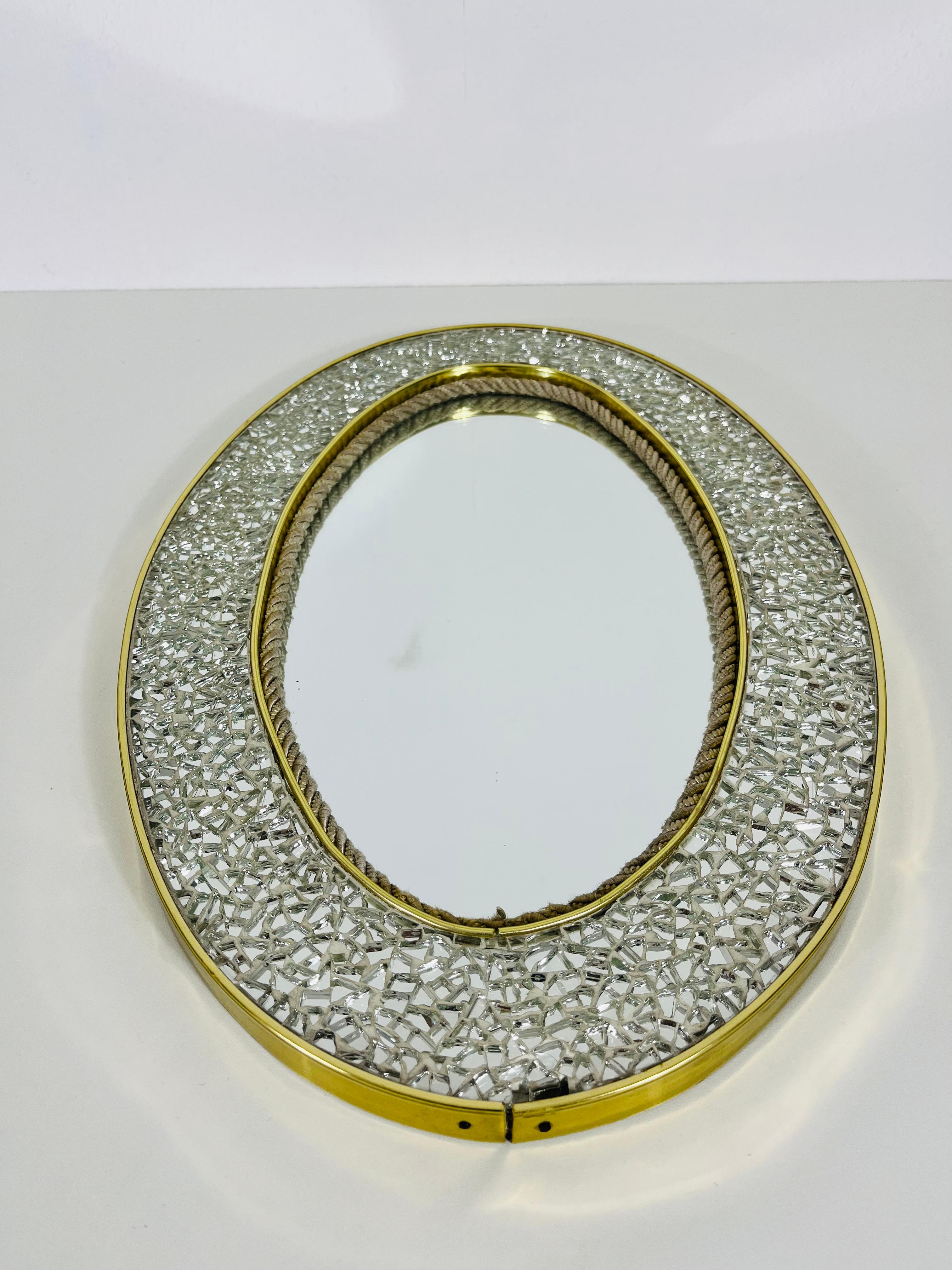 An asymmetrical Italian brass framed wall mirror. Beautiful with its mosaic design.

Good vintage condition. Free worldwide express shipping.

