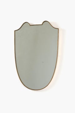 Italian Brass Framed Shield Mirror in the style of Gio Ponti