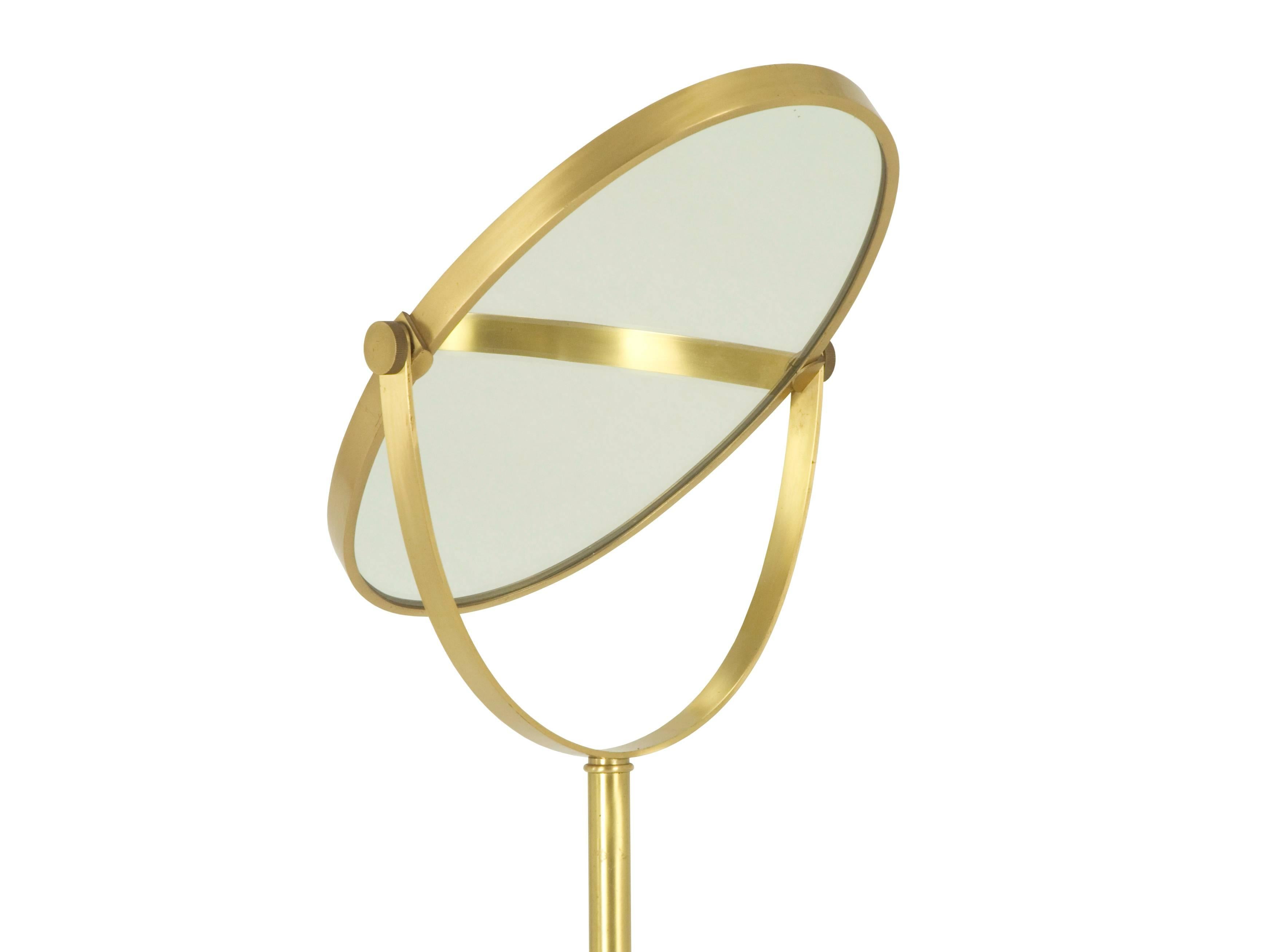 This freestanding floor mirror was designed and produced in Italy between the 1960s and the 1970s. It is made from frosted brass and mirrored glass and it remains in pretty good vintage condition. The mirror is tilting and can be placed in several