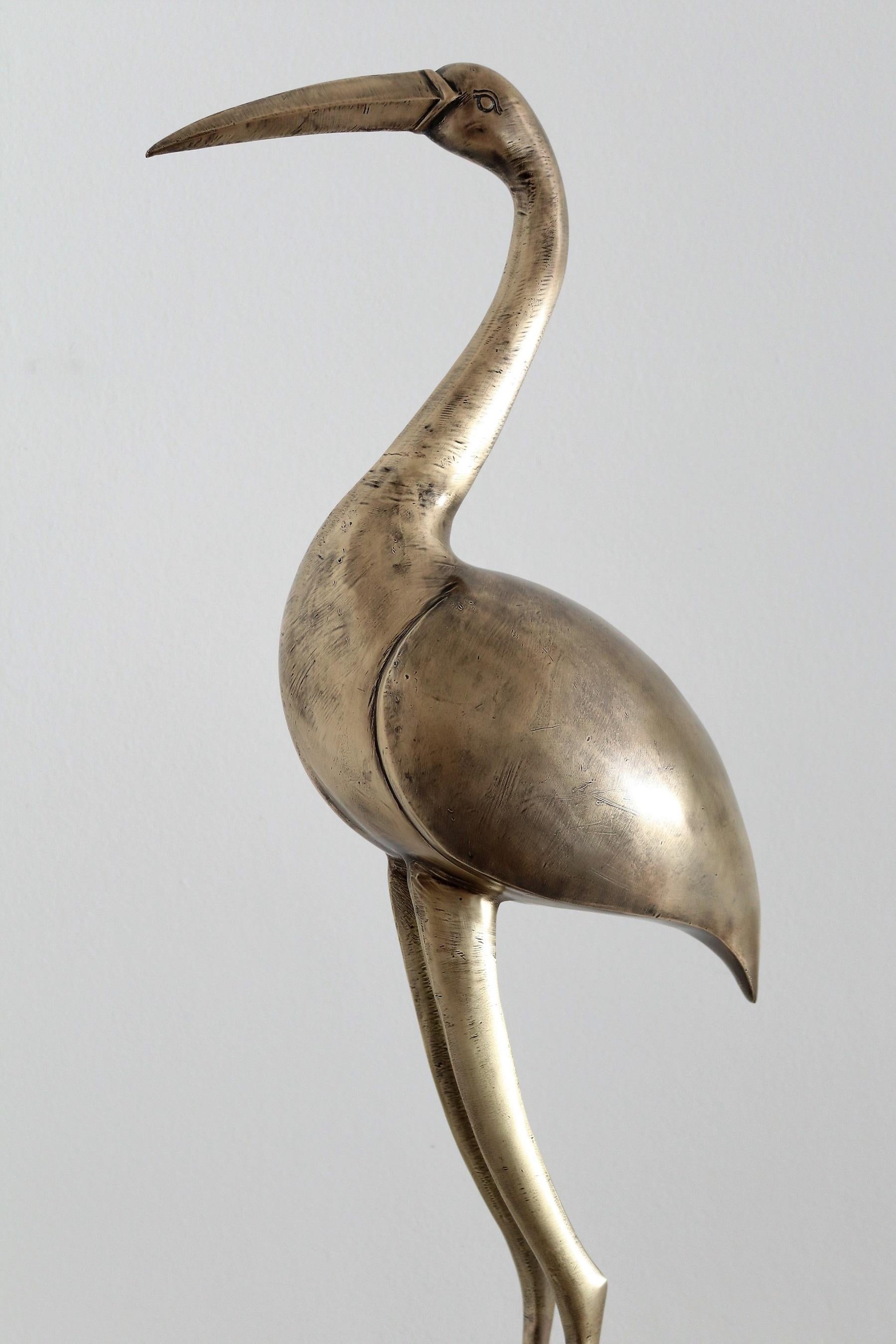 brass crane statue