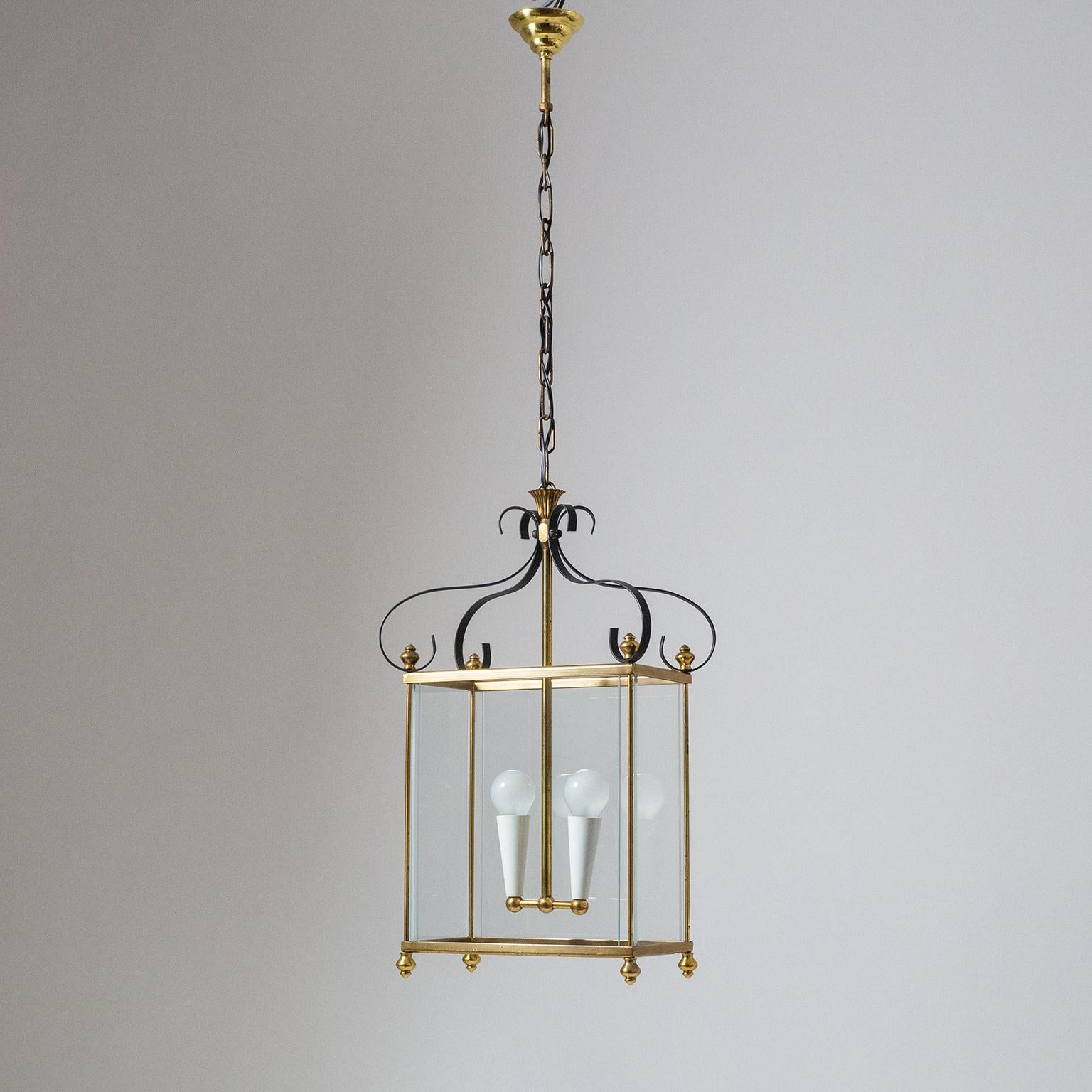 Lovely Italian midcentury brass and glass lantern. The neoclassical lantern shape is reinterpreted with a modernist approach resulting in a very 'light-weight' design. Very nice original condition with a bit of patina on the brass and lacquered