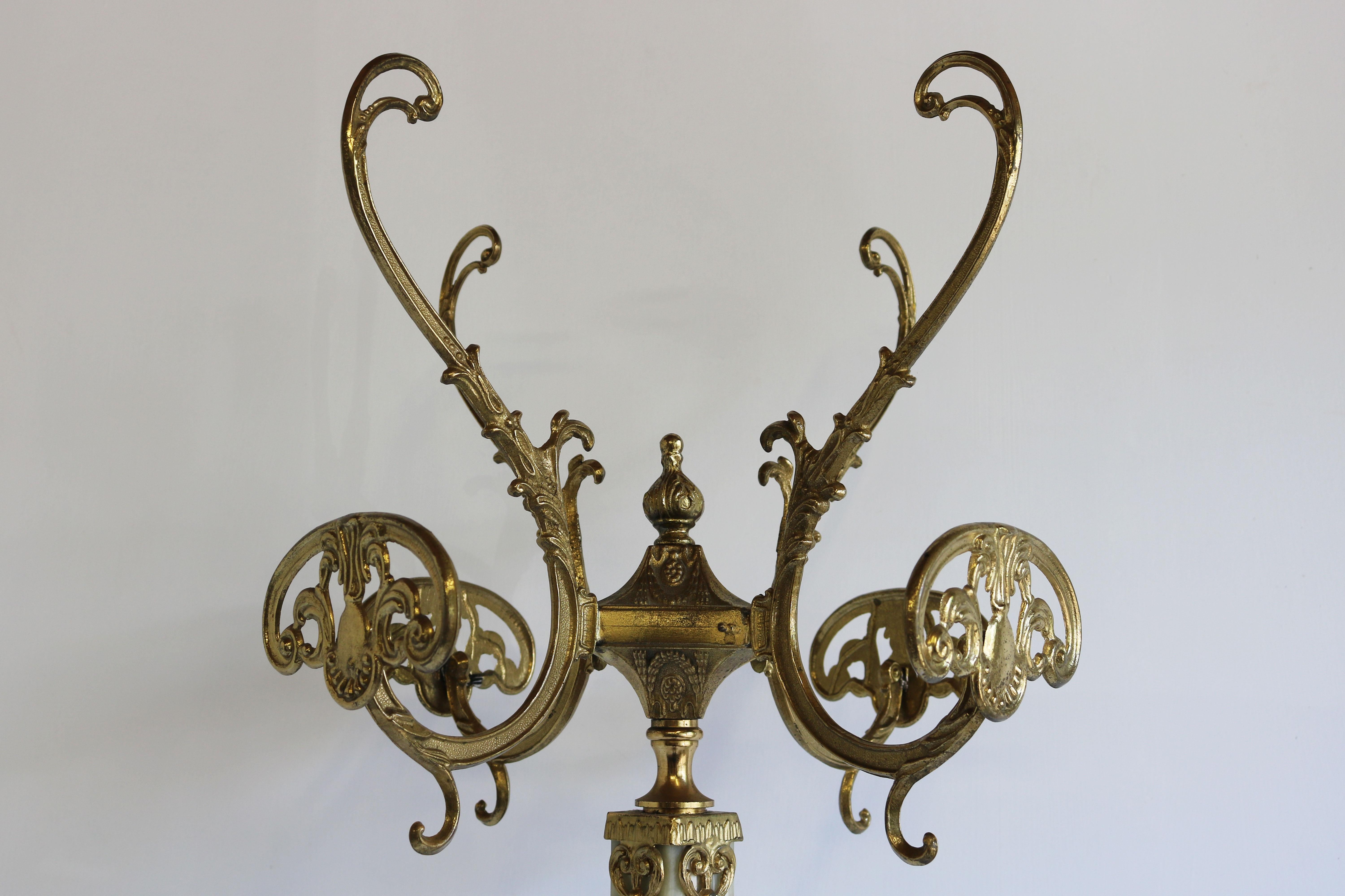 Impressive & luxurious! This marvelous Italian ornate brass coat rack with base decorated Brass details and Onyx marble. Marvelous mid-century design in classical / Hollywood regency style. 
Very nice sturdy quality with amazing details as the