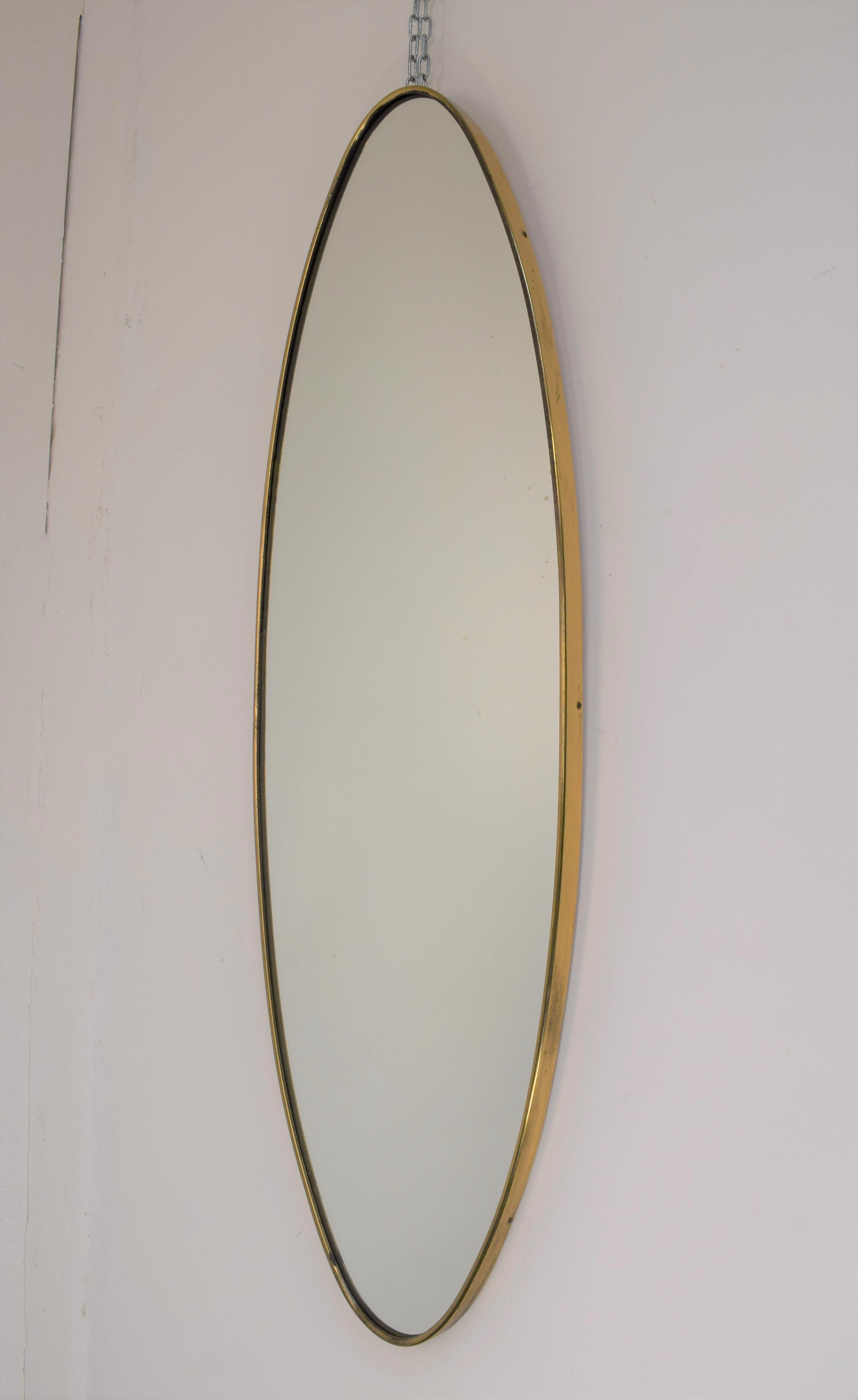 Italian brass mirror, 1960s.

Dimensions: H= 105 cm; W= 35 cm; D= 2,5 cm.