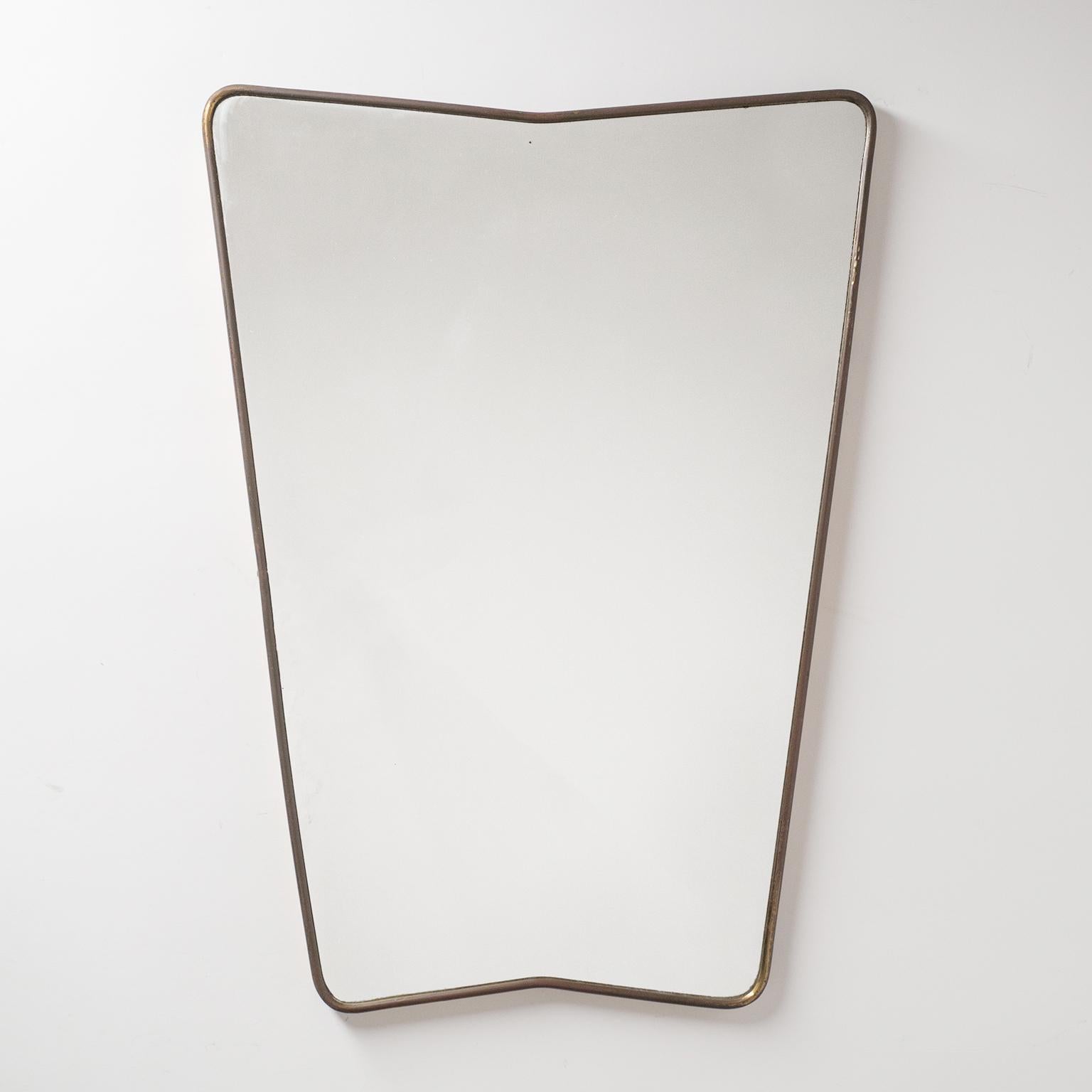 Fine Italian mirror from the 1940-1950s. Continuous brass frame with an unusual trapeze shape.