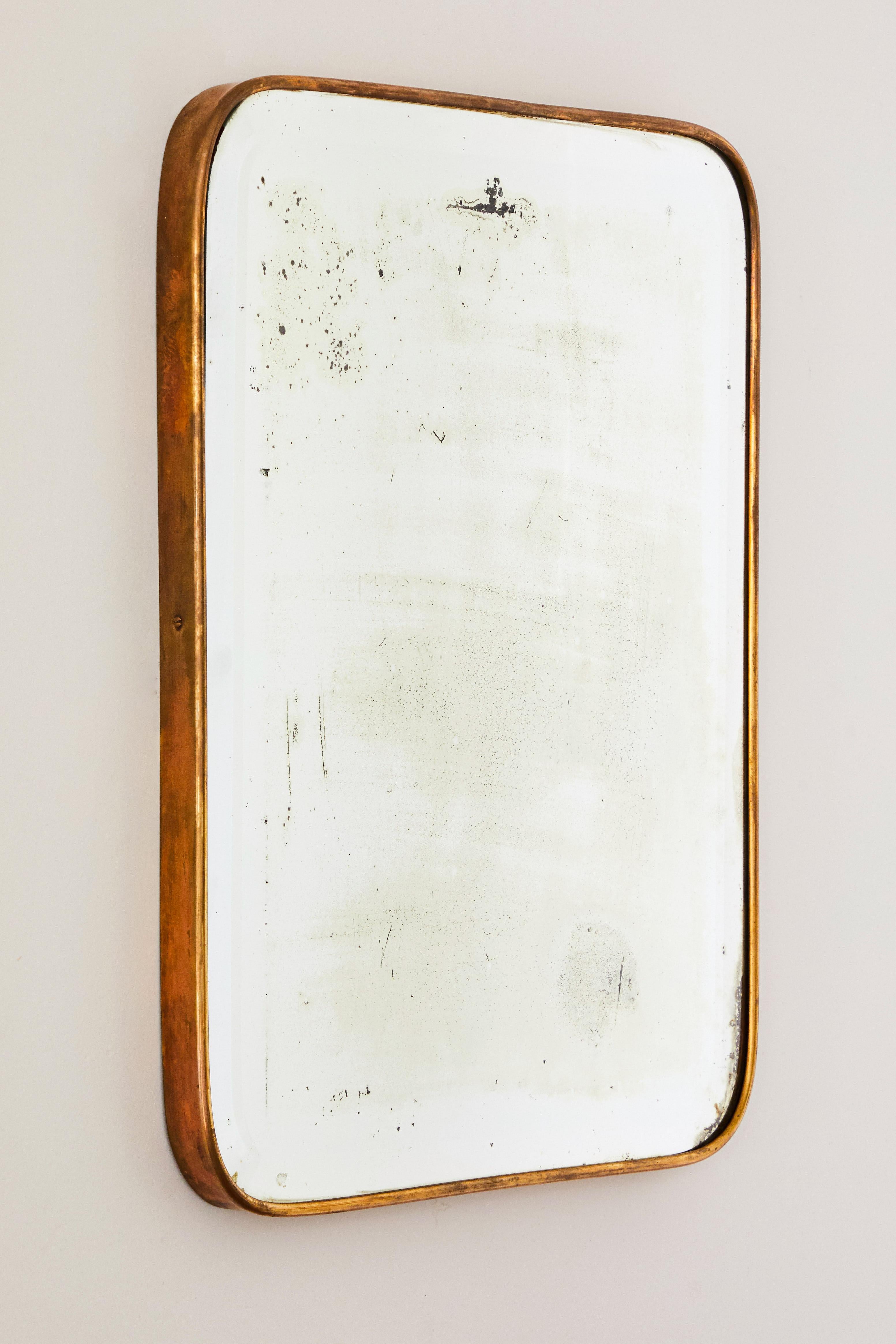 Italian patinated brass framed wall mirror. Made in Italy, circa 1960s.