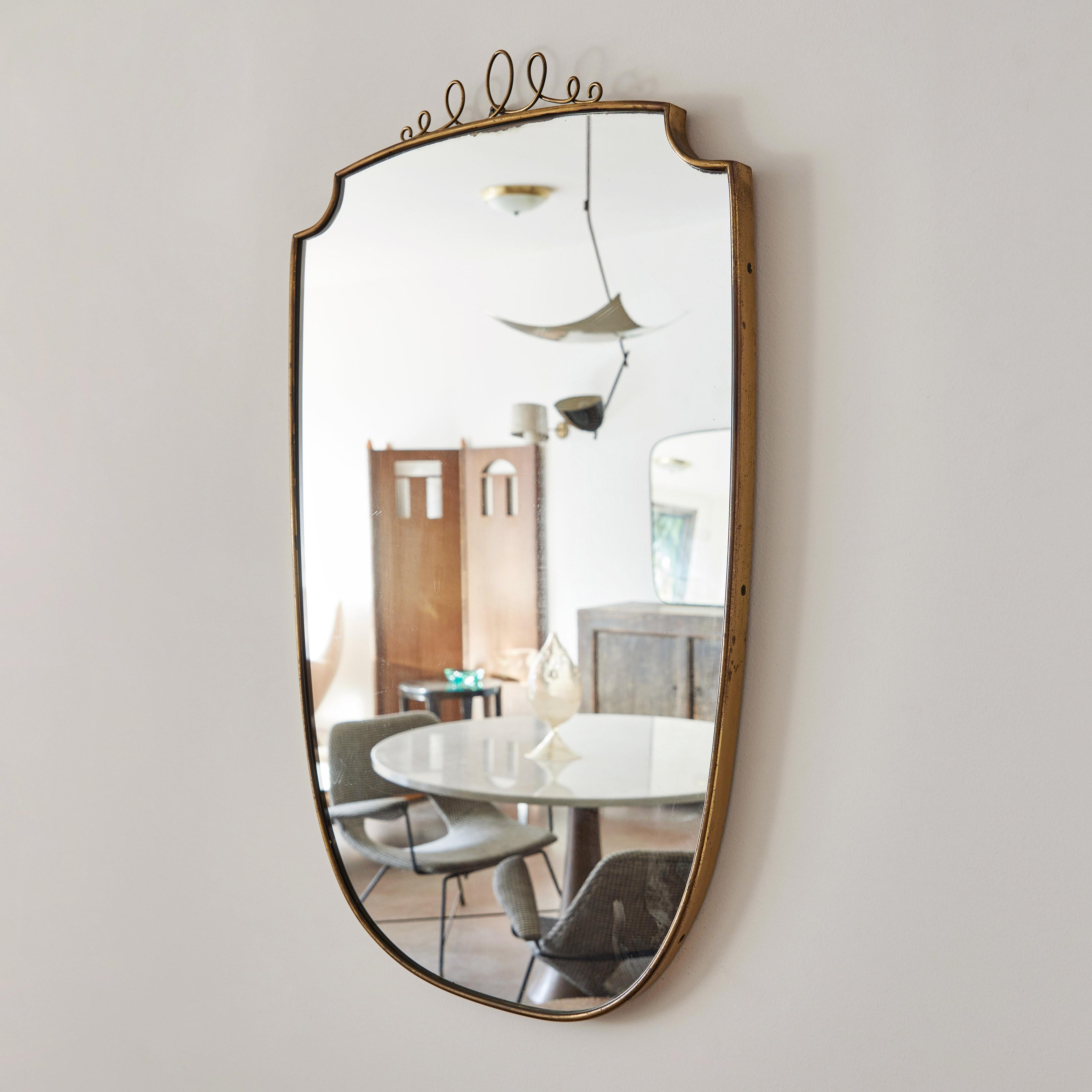 Italian patinated brass framed wall mirror with detail. Made in Italy, circa 1960s.