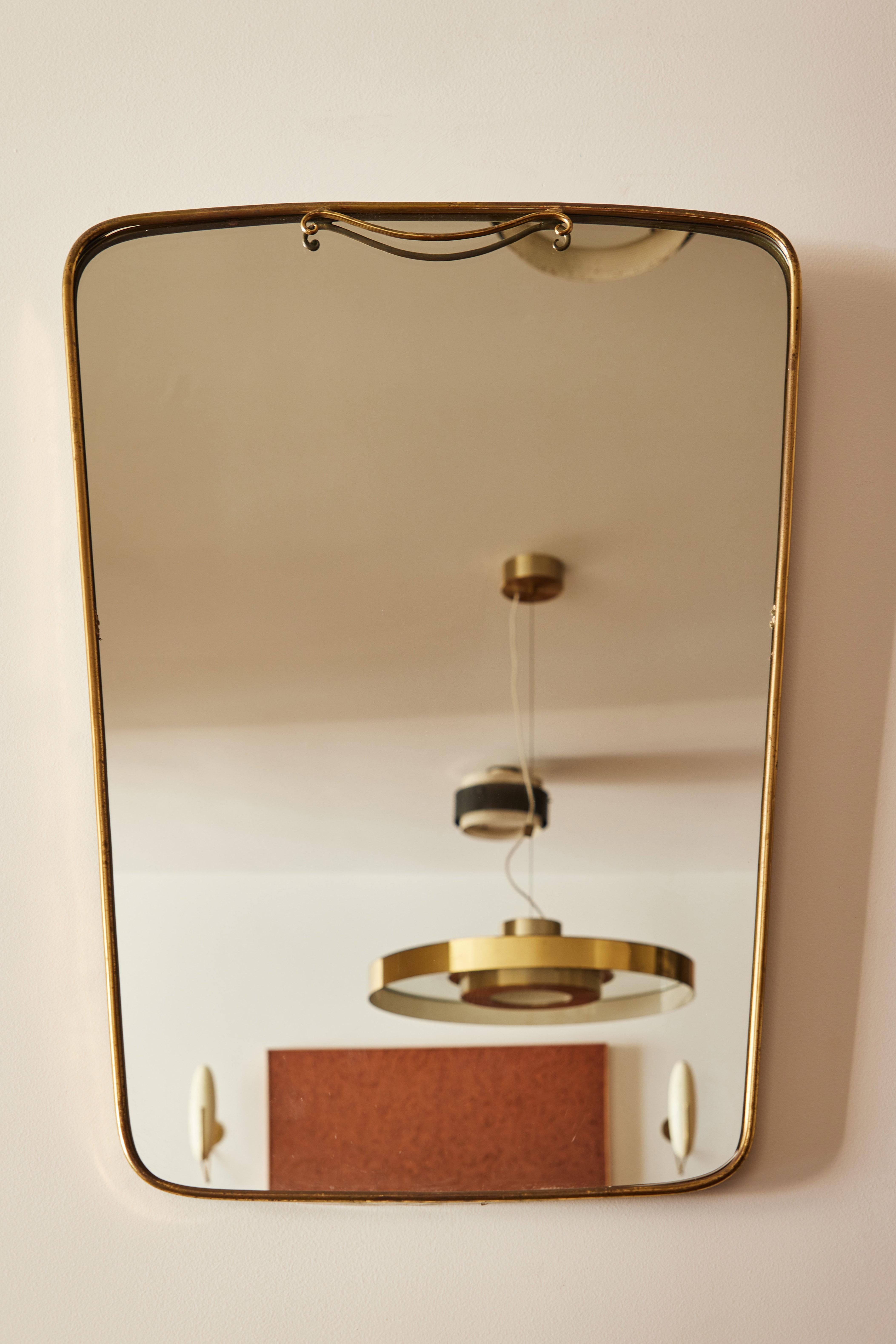 Italian patinated brass framed wall mirror with detail. Made in Italy, circa 1960s.