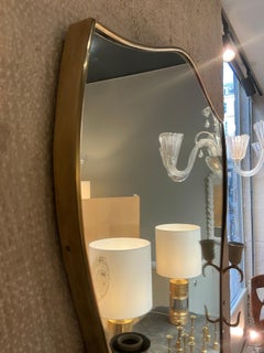 Italian brass mirror with sconces circa 1950