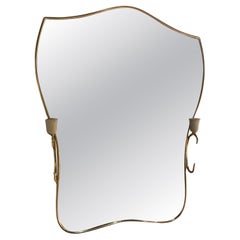 Italian brass mirror with sconces circa 1950