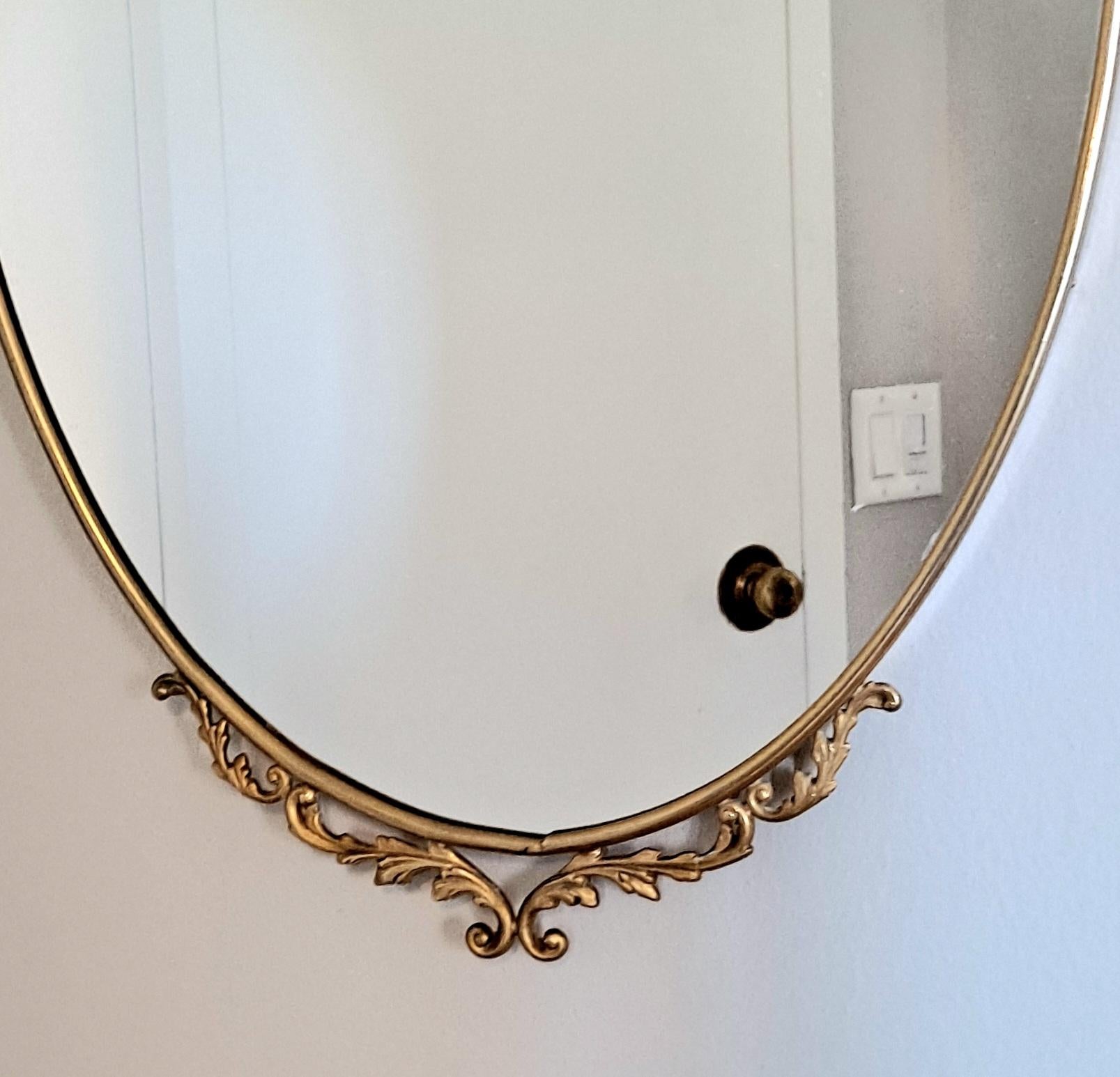 Mid-Century Modern Italian Brass Mirror with the Filigree on Top and Bottom For Sale