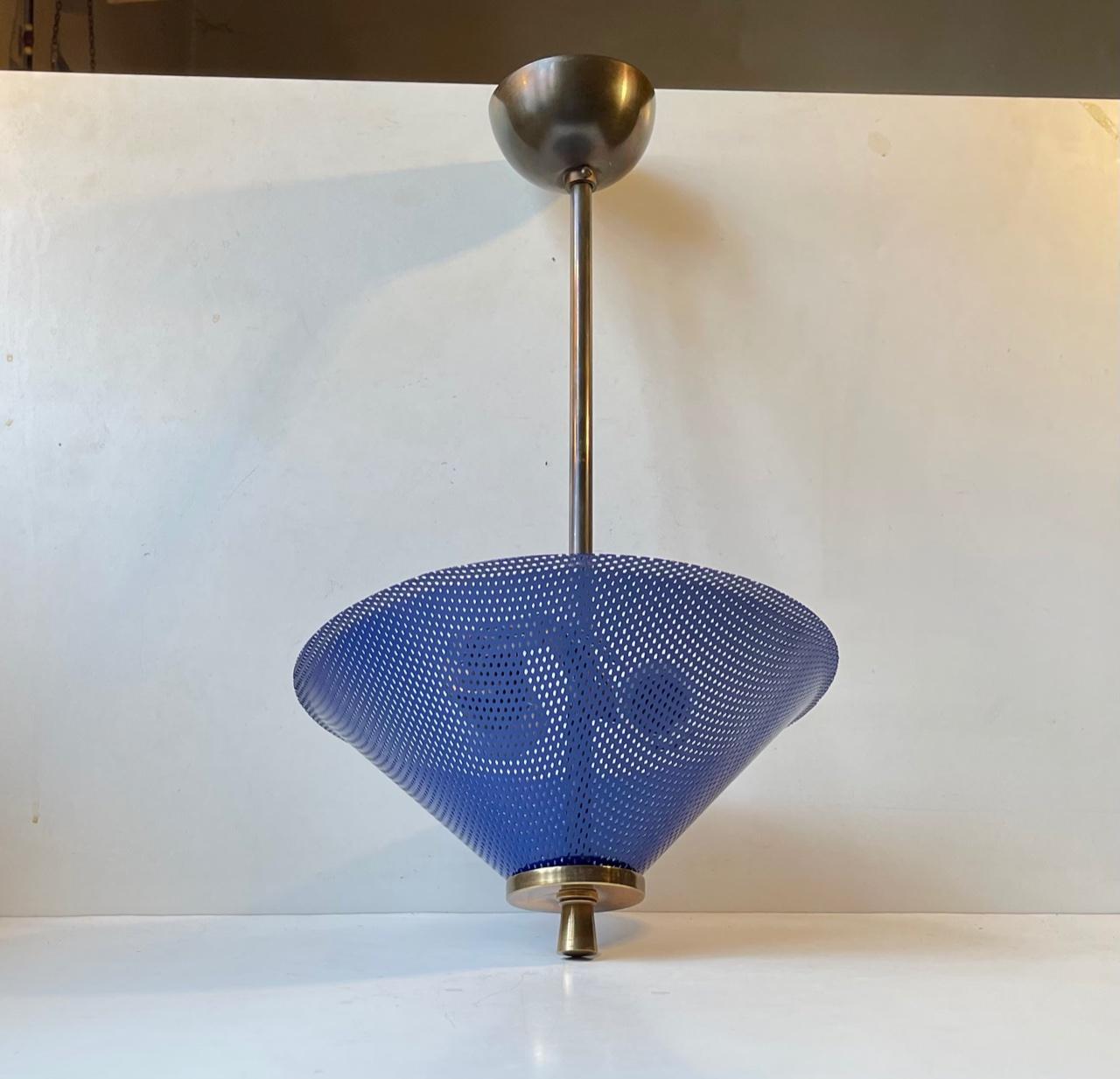 Spectacular ceiling light featuring stem, canopy and porcelain sockets in brass. It has two lightsources and a vibrant blue shade. It was made in Italy during the 1950s in a style inspired by Jacques Biny. It is intended for areas where an