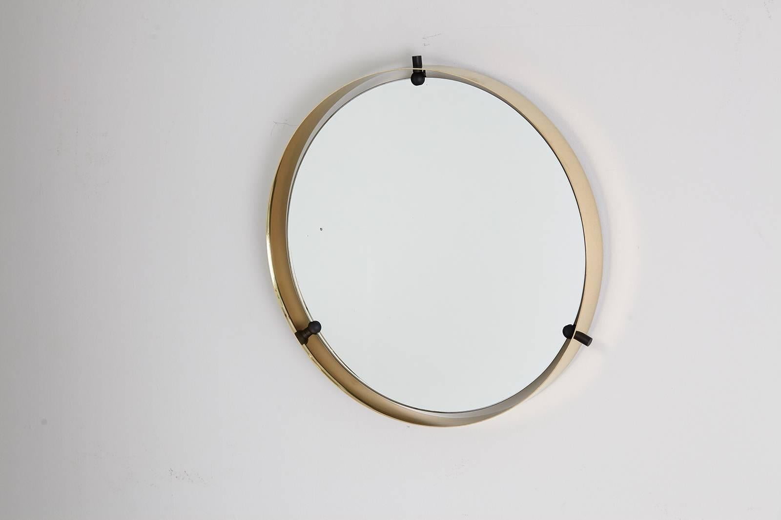Gorgeous Italian mirror in brass frame suspended by three black iron hardware.

Measures: Mirror itself measures 18.75