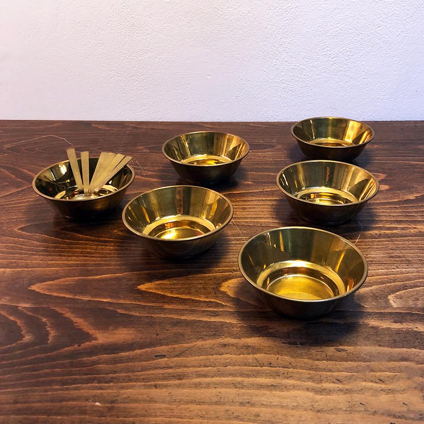 Italian brass set of fruit salad bowls, 1970s. Brass fruit salad bowls, consisting of one larger and six smaller, complete with 6 teaspoons and a ladle always in brass.