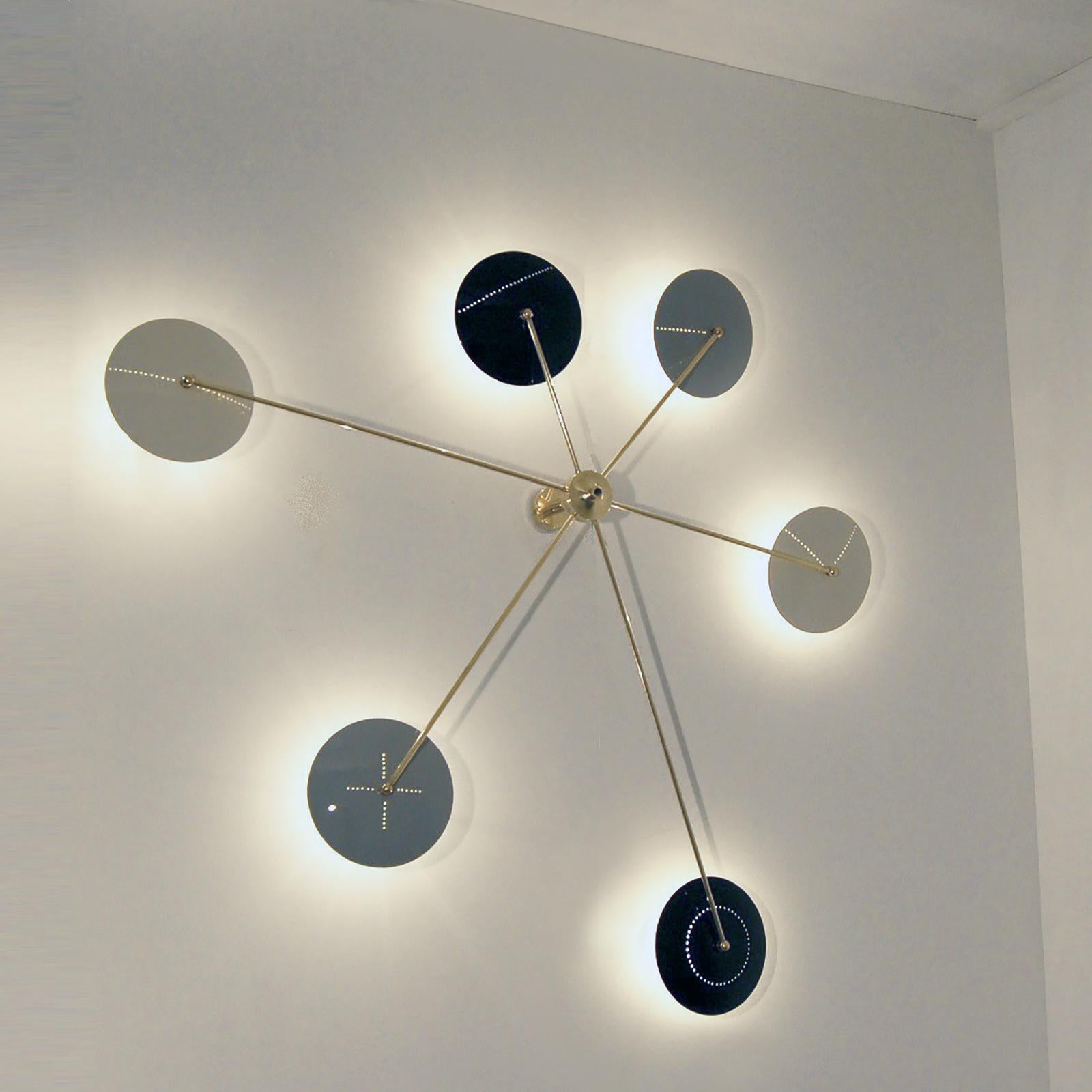Inspired by the Italian midcentury designs, this ceiling / wall light will make the focus center of your interior. The arms radiate all around the stem, each ending with a metal shade finished in glossy powder coated paint, standard colors are light
