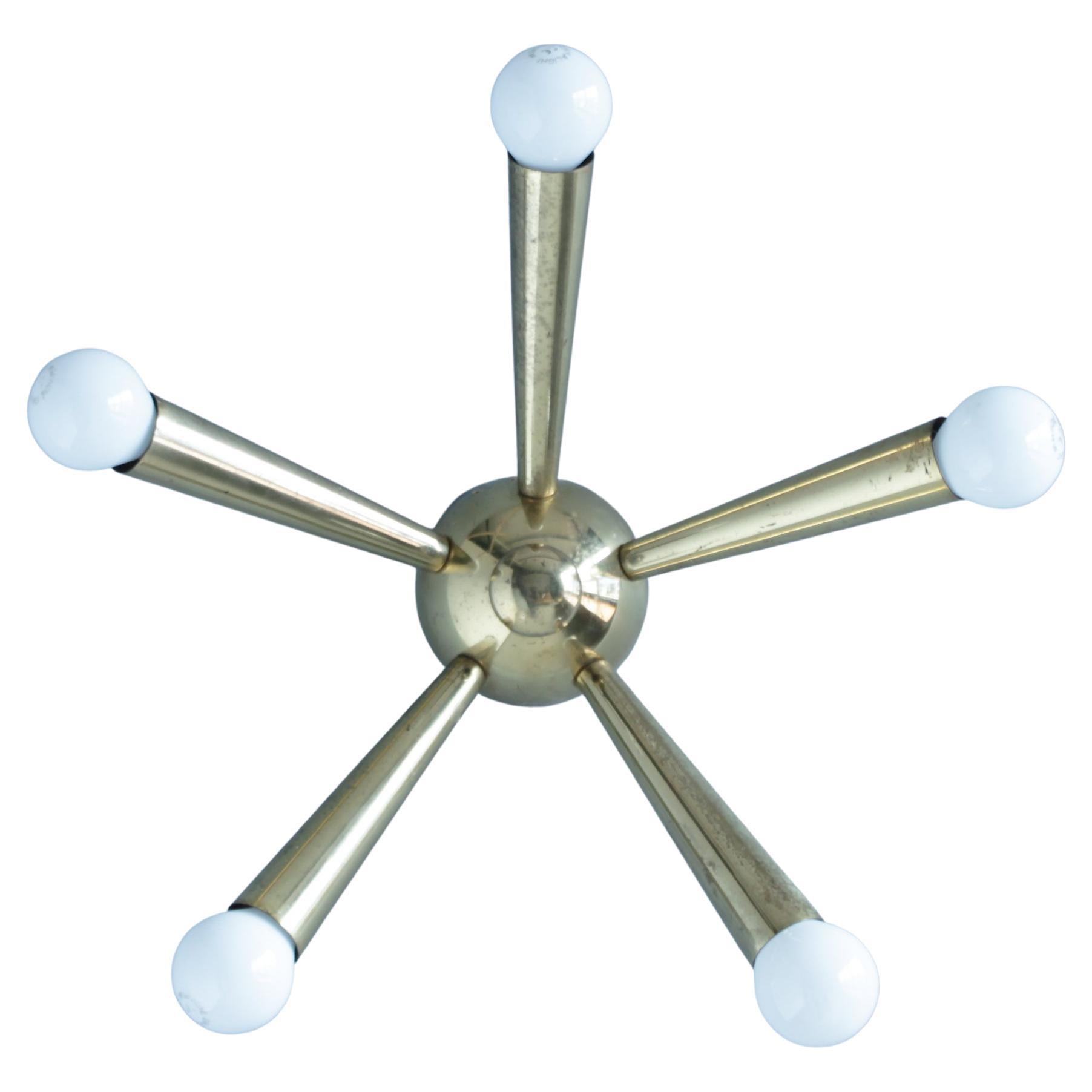 A highly decorative 5 arm sunburst, Sputnik or spider Italian ceiling lamp in the style of Arredoluce and Stilnovo. 
Dimensions: height 4.7 in. (12 cm), diameter 12.8 in. (32,5 cm), length single arm 5.7 in. (14,5 cm).

Consistent with age and