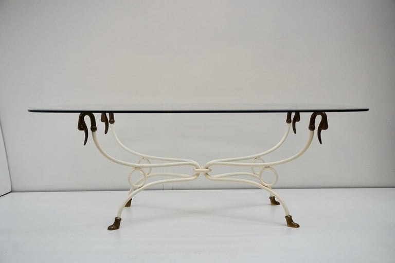A chic and elegant 1950s Italian brass swan coffee table with swan head legs and original glass.
Well-made and heavy.

Dimensions base:
Width 97 cm.
Depth 57 cm.
Height 48 cm.