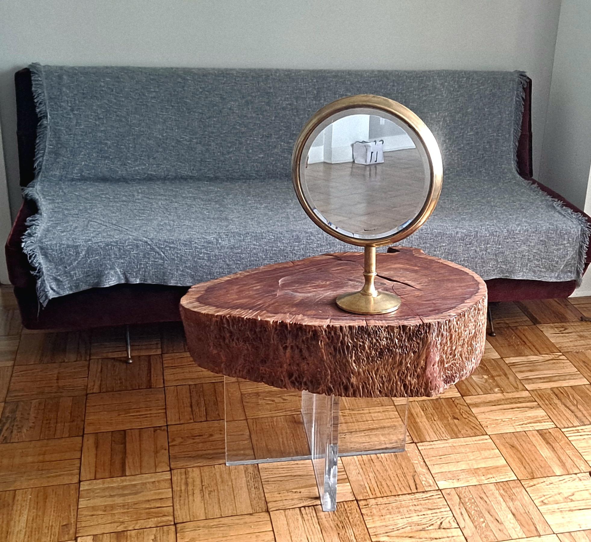 Italian brass beveled round mirror in style of Ico Paricsi. Adjustable position great for the vanity table or jewelry store. 
Base is 7.2 diameter.