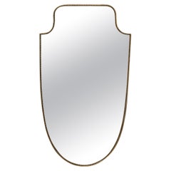 Italian brass wall mirror attributed to Gio Ponti, 1950s.