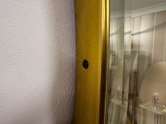 Miroir mural italien en laiton, vers les années 1970.