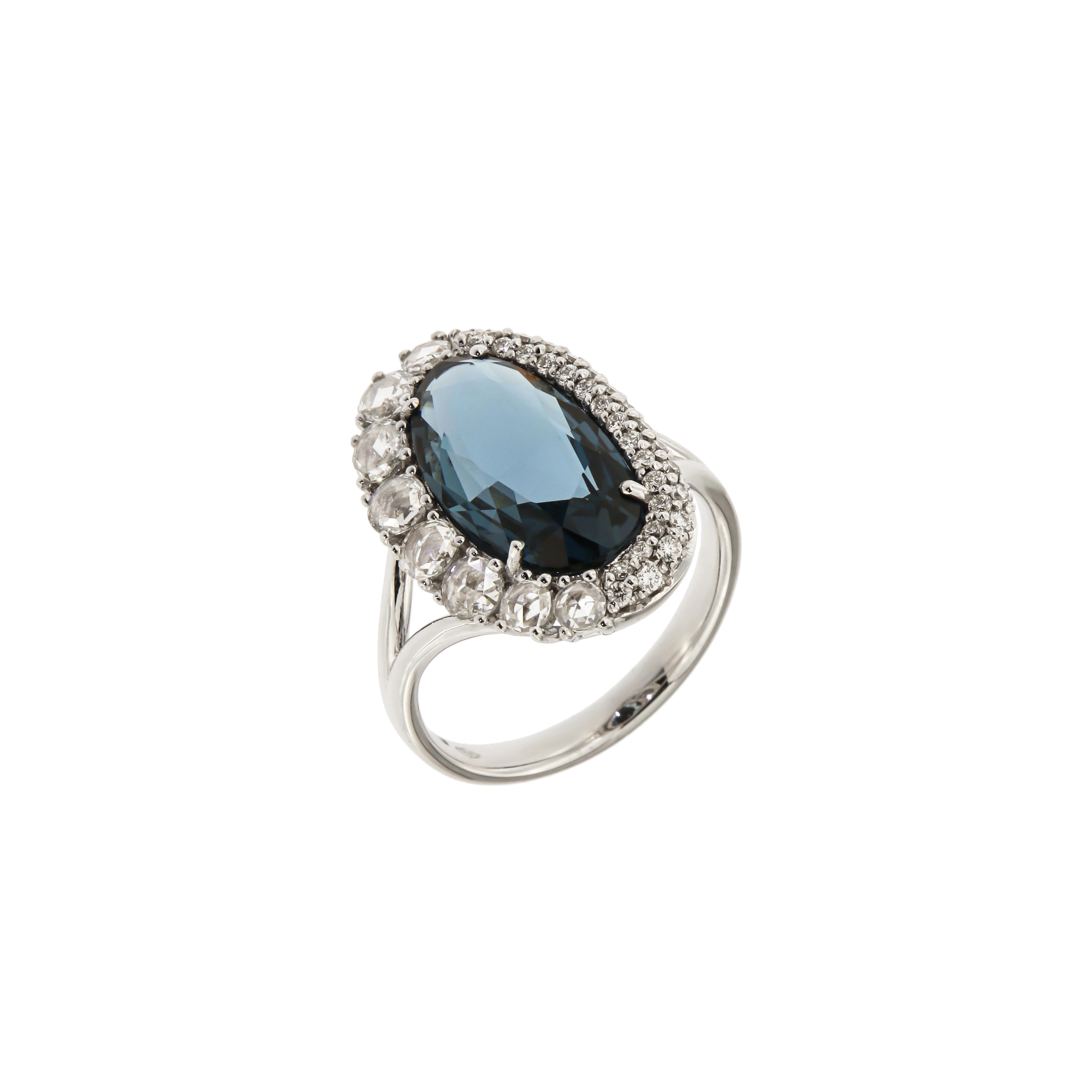 Ring White Gold 18 K (Matching Necklace and Earrings Available)
Diamond 0,78 ct
London Blue Topaz 

Weight 6.30 grams
Different Sizes Available

With a heritage of ancient fine Swiss jewelry traditions, NATKINA is a Geneva based jewellery brand,