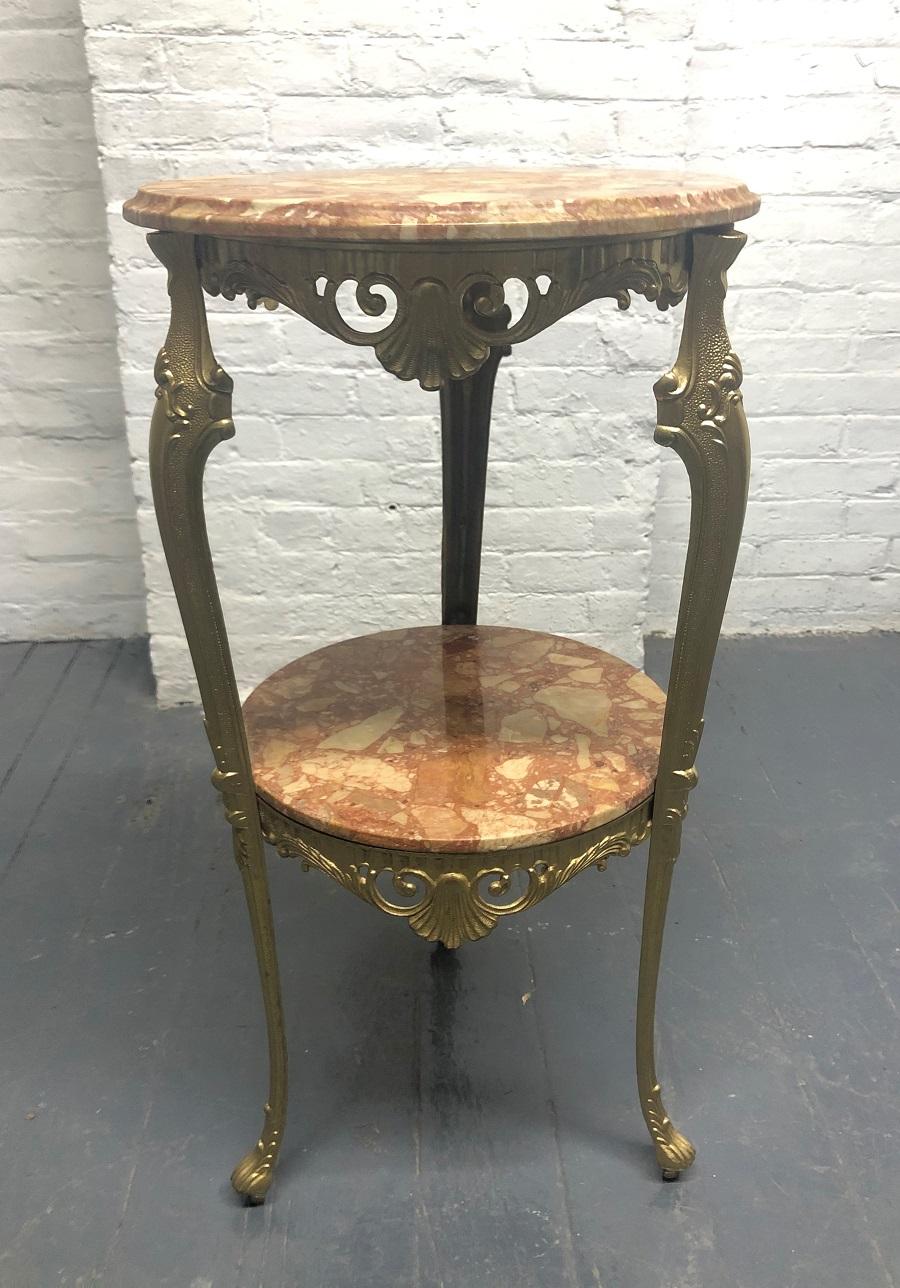 Italian, bronze and marble two-tier pedestal. The pedestal has a very decorative bronze frame. The top marble is beveled.