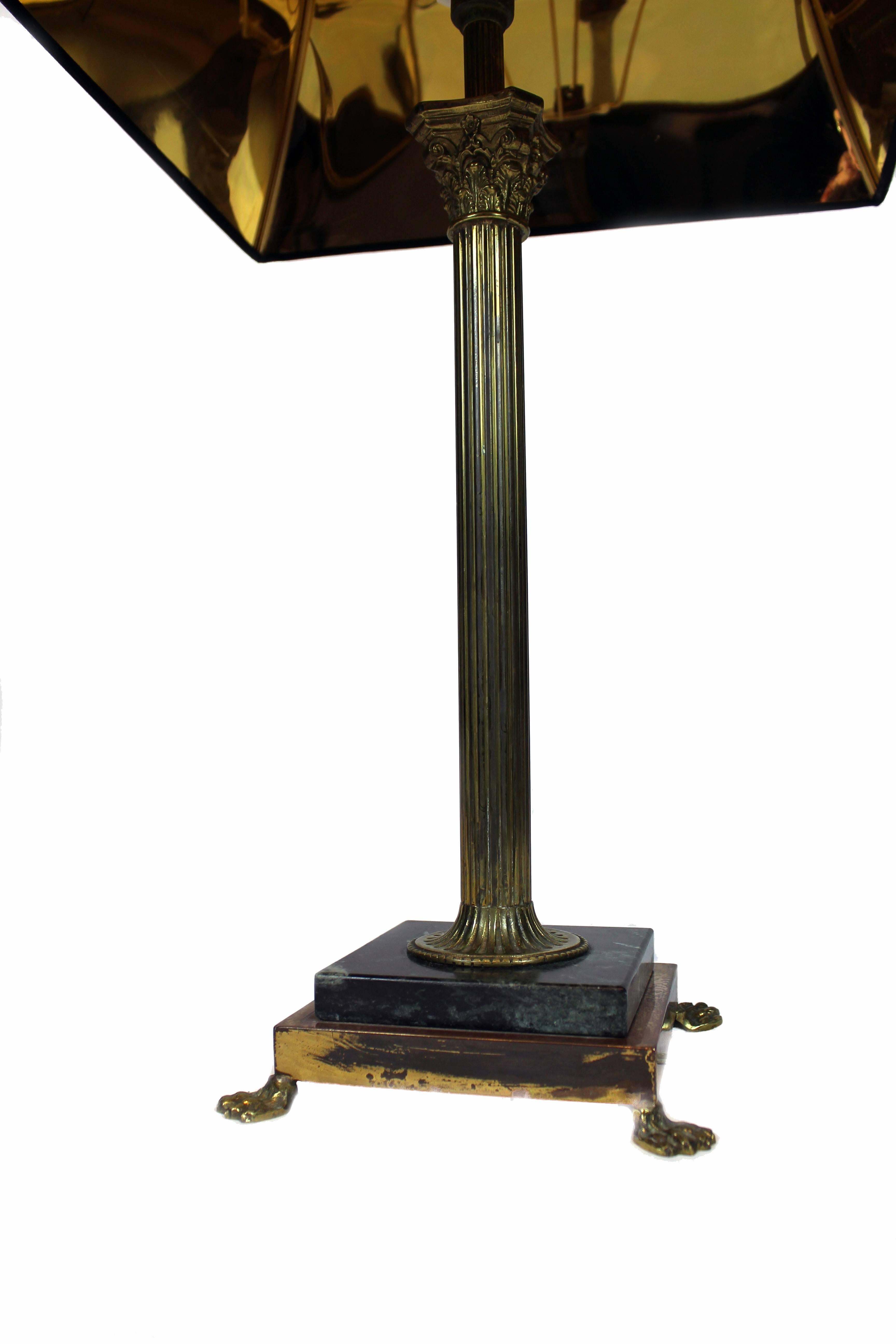 Table lamp with a base made of marble and bronze. The feet of the base seem like lion feet. Made in Italy, circa 1920.