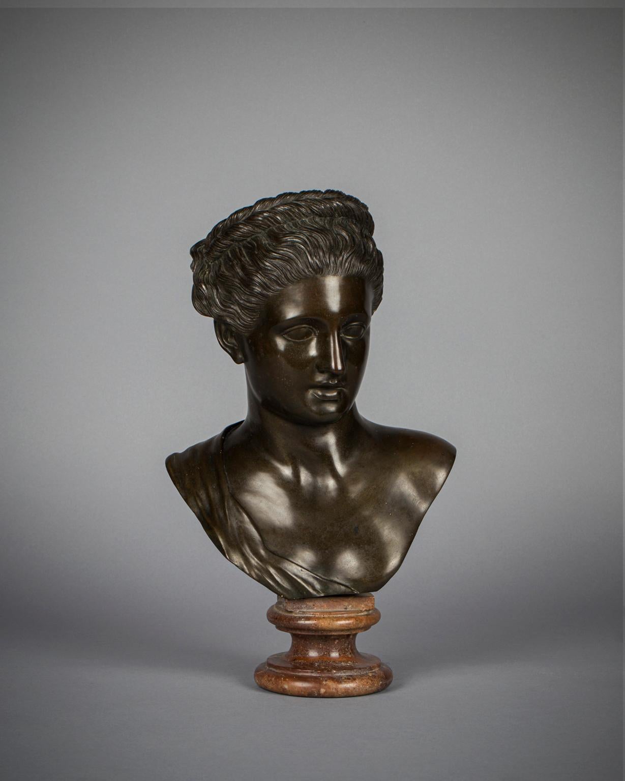 With classical features, her hair and wreath finely and crisply delineated. 