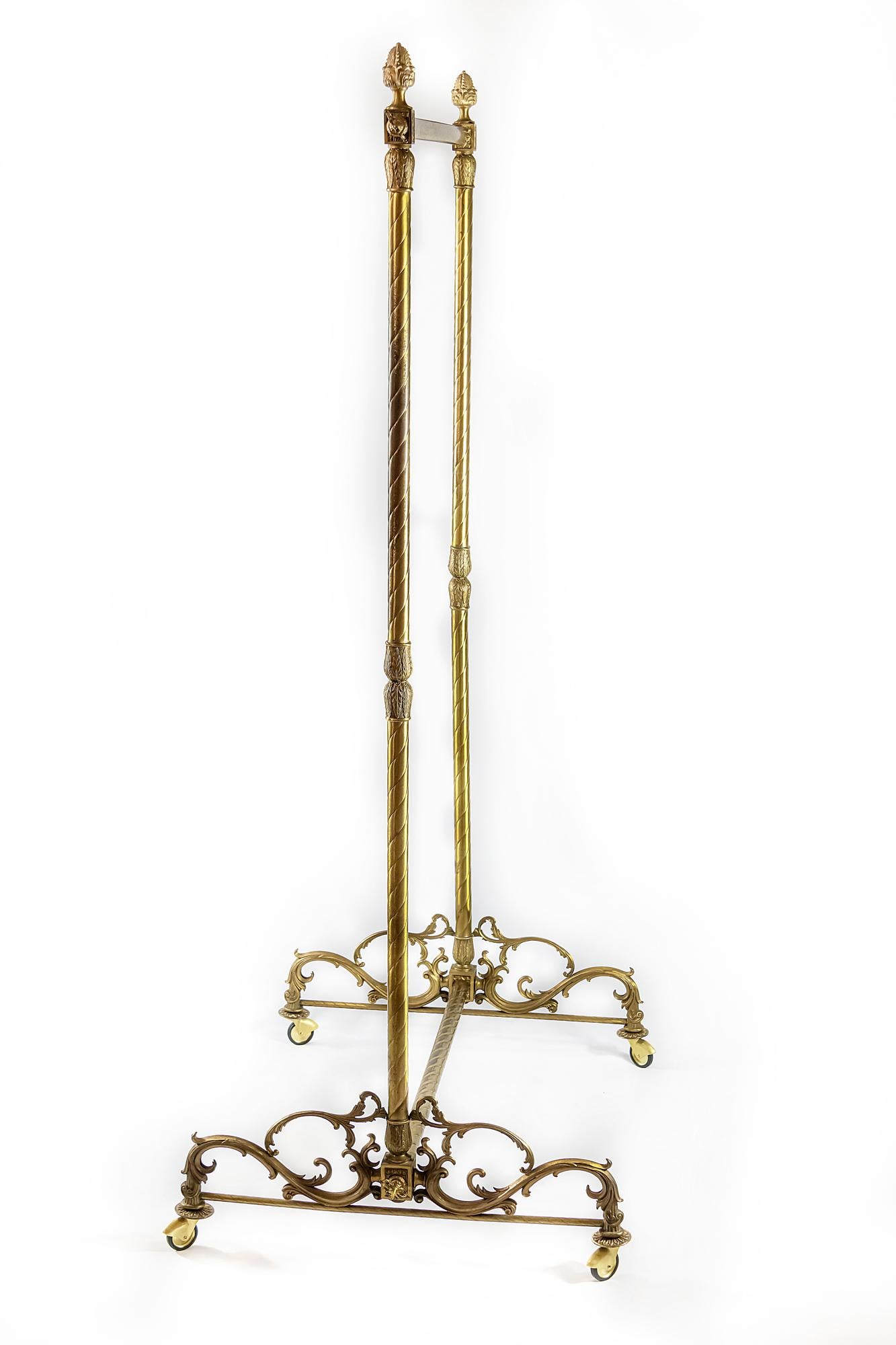 Antique Italian coat / clothes rack stand is made of bronze. 
The rack Stand base in on brass wheels renovated into new ones. 
For delivery can be disassembled.