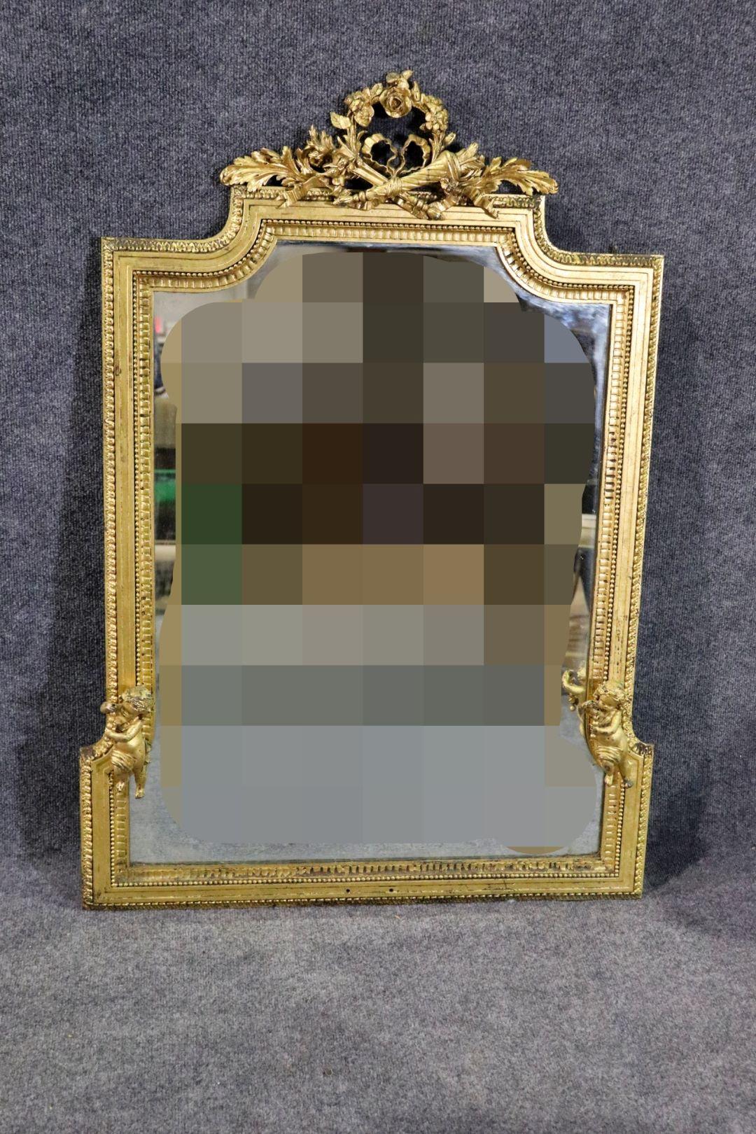 Antique Caldwell & Co. Classical Gilt Bronze Wall Mirror Bronze frame. Figural Frame carved Putties

Dimensions: 42 3/8