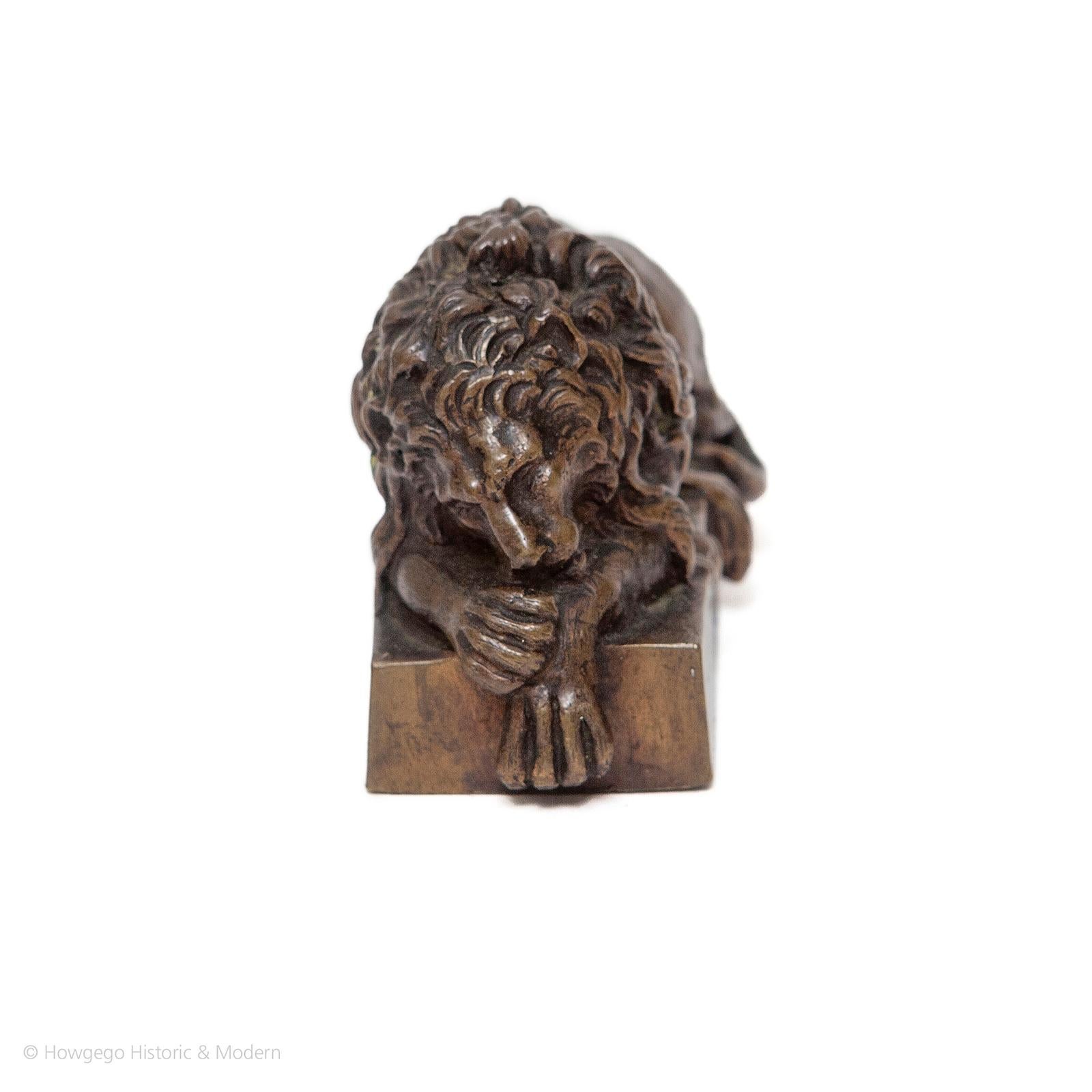 - Beautifully modelled and cast
- Atmospheric reference to the iconic original lions
- Grand Tour collectible

An Italian bronze model of a sleeping lion, early-19th century. Modelled after Antonio Canova. On rectangular bronze base. 

The