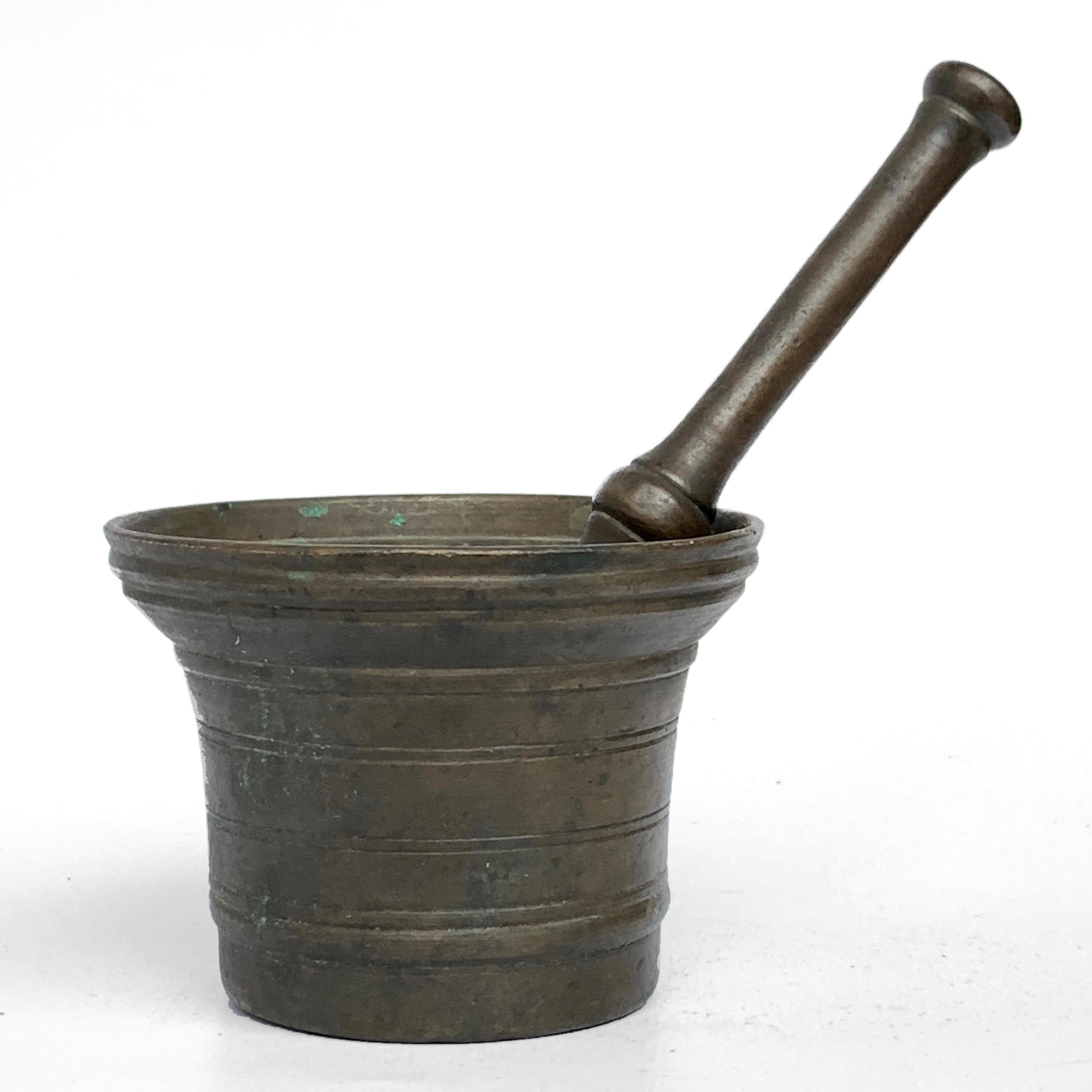 Antique bronze mortar. Handmade with pestle. Original patina

Italian bronze mortar and pestle
Measures: Pestle height 7.5 in.