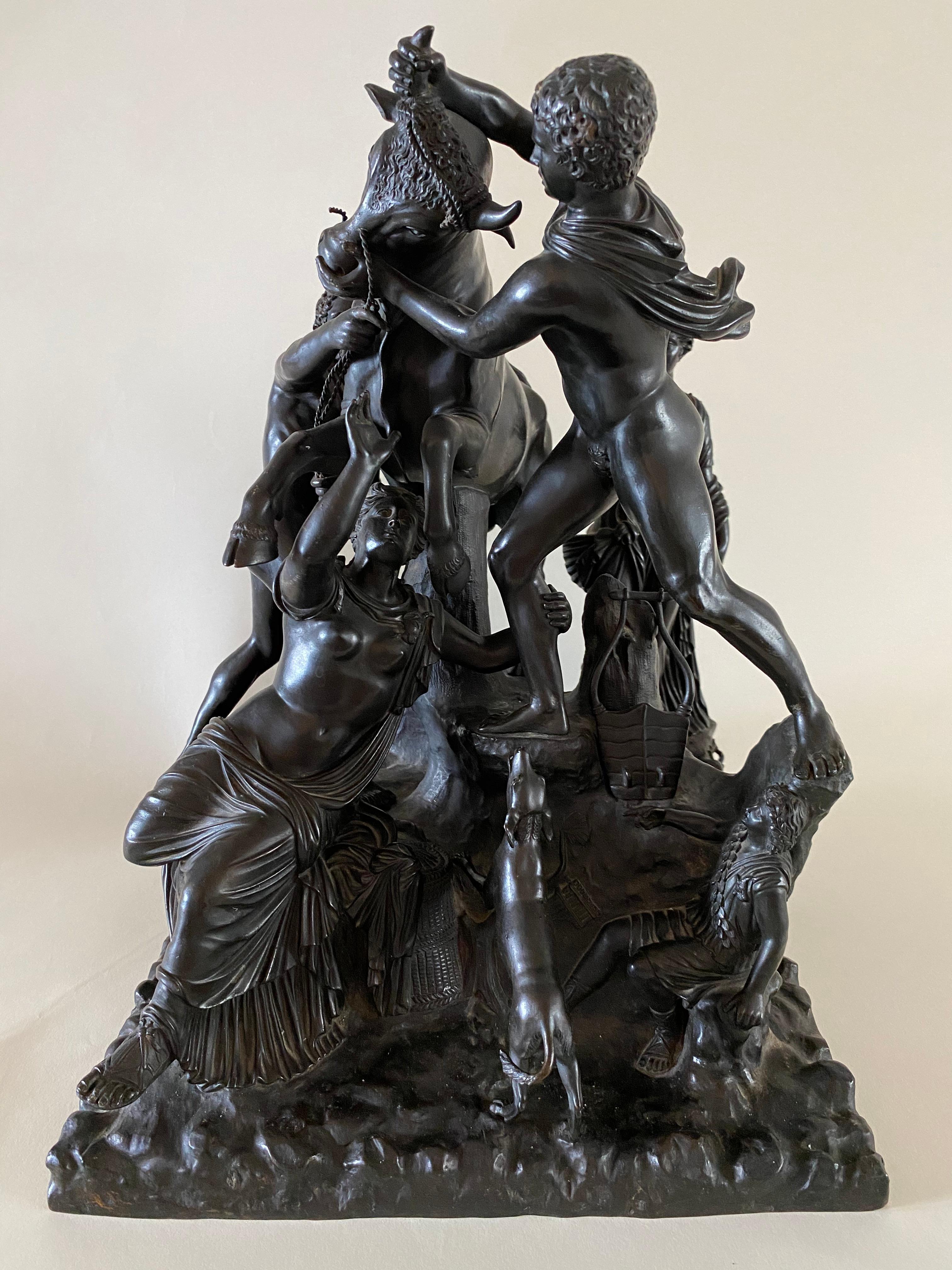 This Italian bronze sculpture group of the Farnese Bull, after the antique, is handsomely modeled and detailed throughout with a lovely blackish to cocoa brown patination, each separately cast figure centering an enraged bull while standing on a