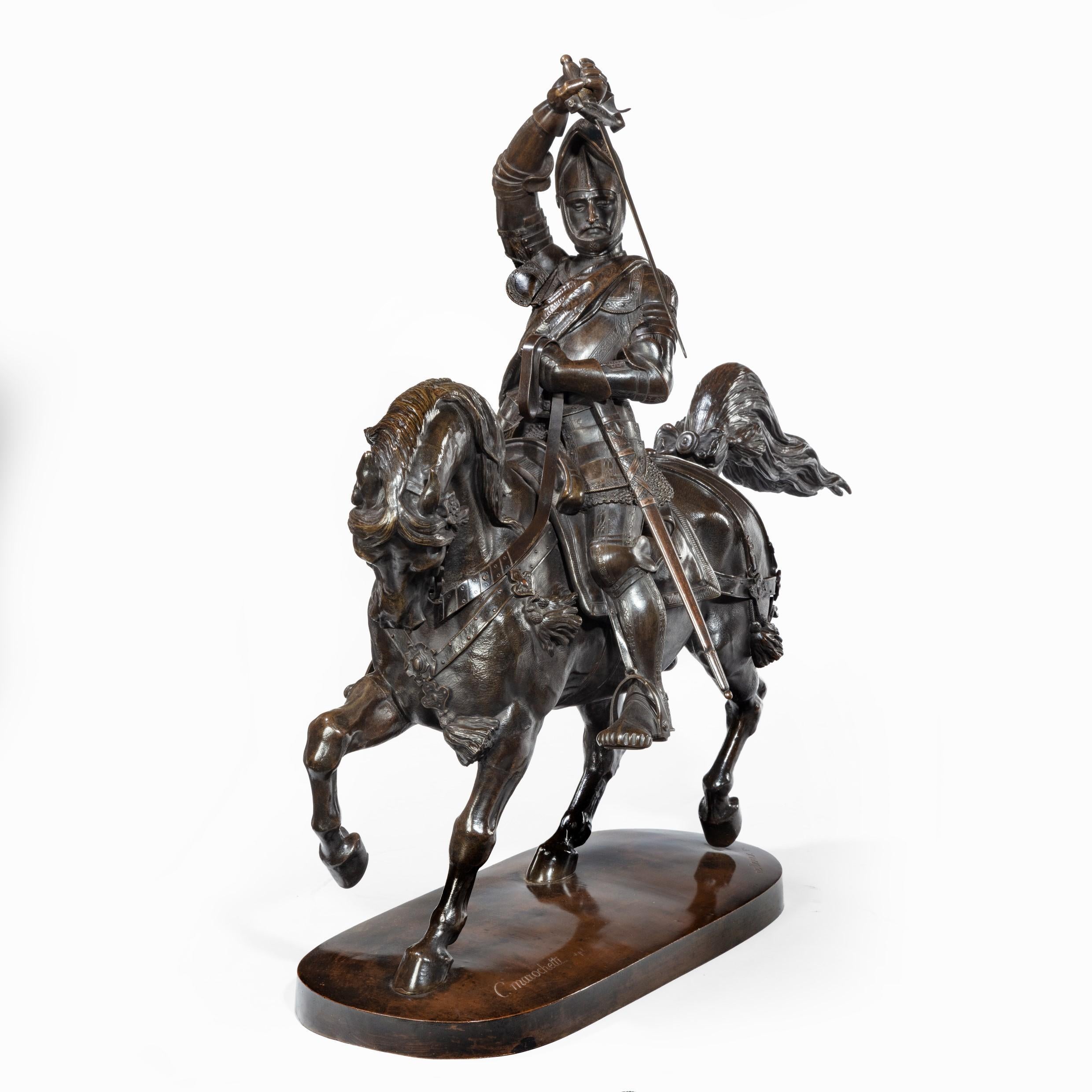 An Italian bronze equestrian sculpture of Emanuele Filiberto, Duke of Savoia, by Baron Carlo Marochetti, the duke wearing full armour with the visor of his helmet up and drawing his sword in front of his face, riding a prancing horse, the base