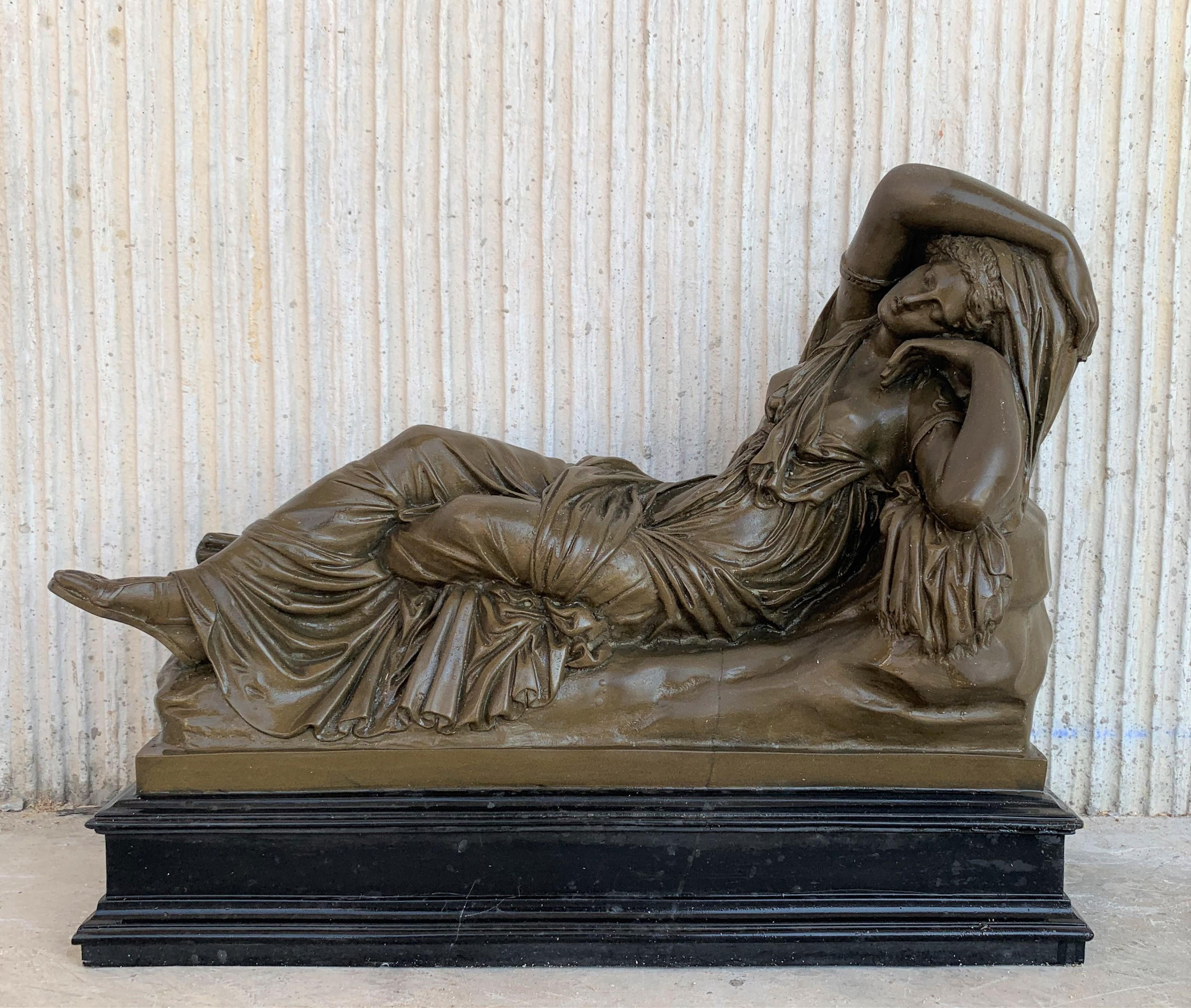 Italian bronze Tuscany neoclassical style sculpture featuring a relaxed woman in black base.